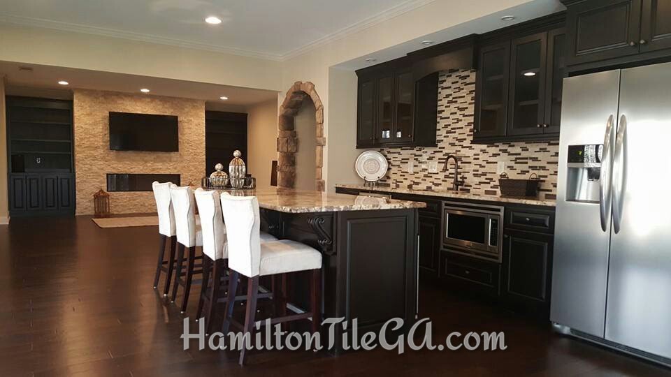 We did the stonework, backsplash, and accent wall in the basement seen here. 2/16.