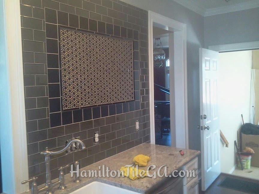 A very unique backsplash by referral from the electrician.