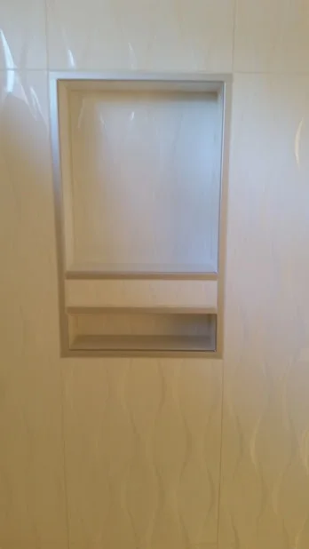 A sleek inset box edged with Schluter Quadec profiles.