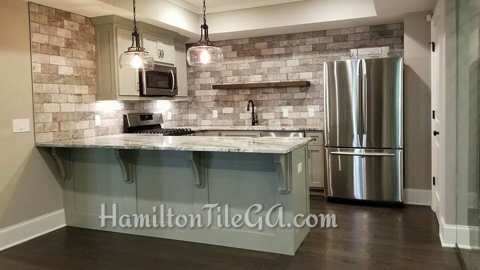 Hamilton Tile is your go to for back splash installations. Spectacular taste from these folks located in Milton, GA. Click here to learn how the positioning of your under cabinet lighting can make or break the over all look of your back splash.