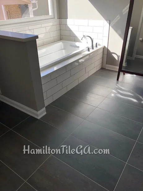 Ended up having to straight set this tile because these 12”x24” tile were so brutally warped, no way an offset would work out, lips would be noticeable. This customer trusted our expertise and we were able to set these straight set and get a nice, flat floor. To be frank, our finished product depends on the material we get. There’s ways to disguise imperfections in material, but we need your trust and confidence to utilize our skill and experience. We will always have your best interest in mind.