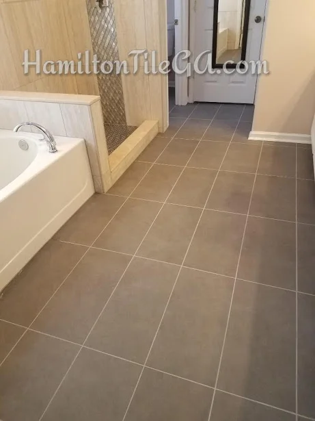 The shower leaked and this persons insurance company paid for the bathroom floor. Not bad, all things considered. Straight set 12x24’s is always the way to go! Not only do you get a flatter floor, and the ability to get larger pieces everywhere in your layout, it’s also a more contemporary, modern look.