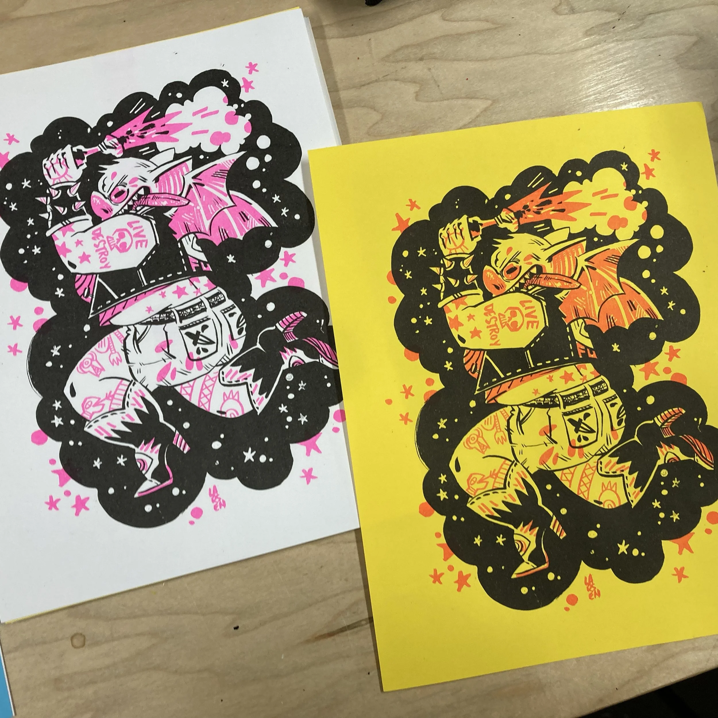 Riso bat prinys in pink and black on white and yellow paper.