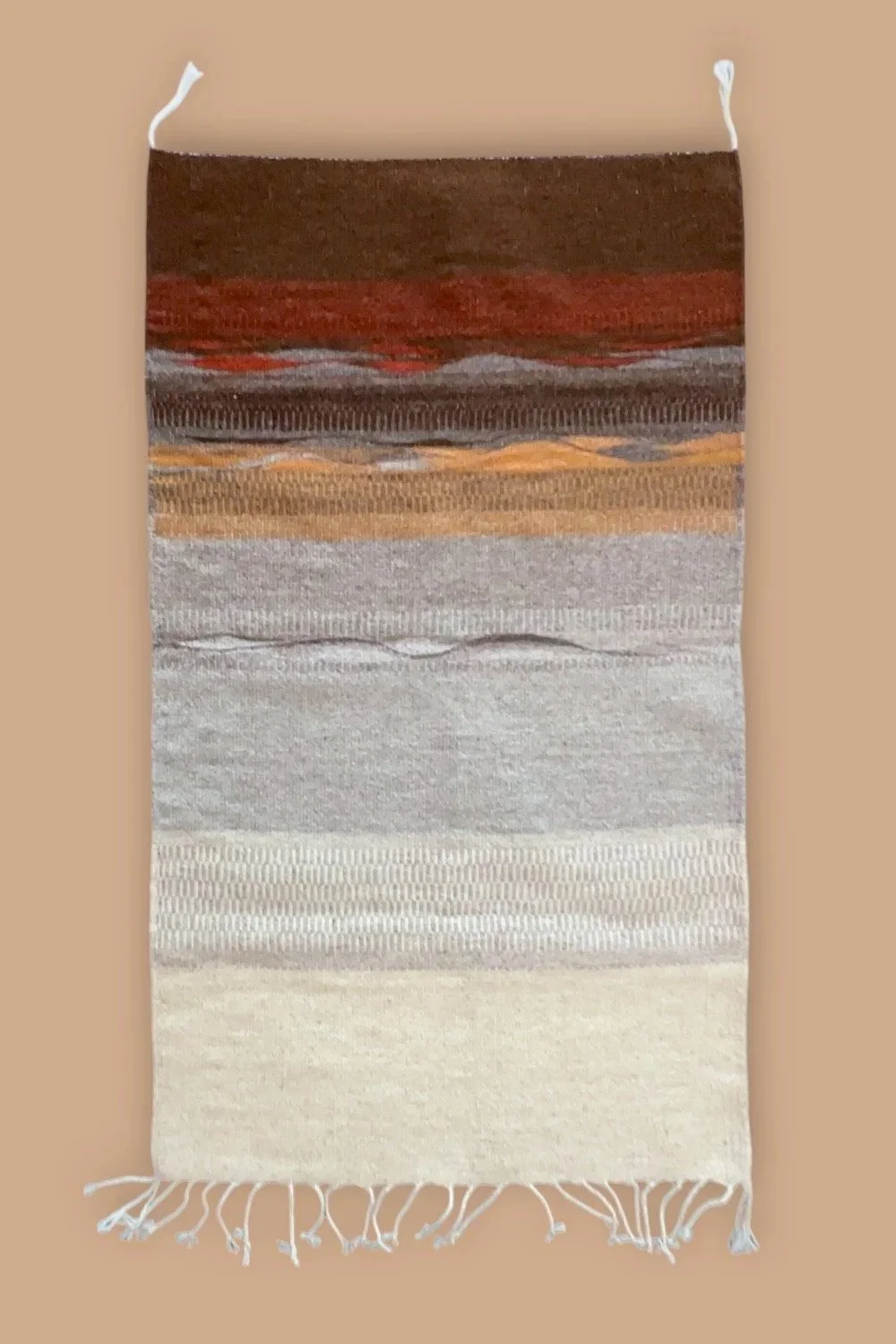 Handwoven wool rug for the wall in warm colors