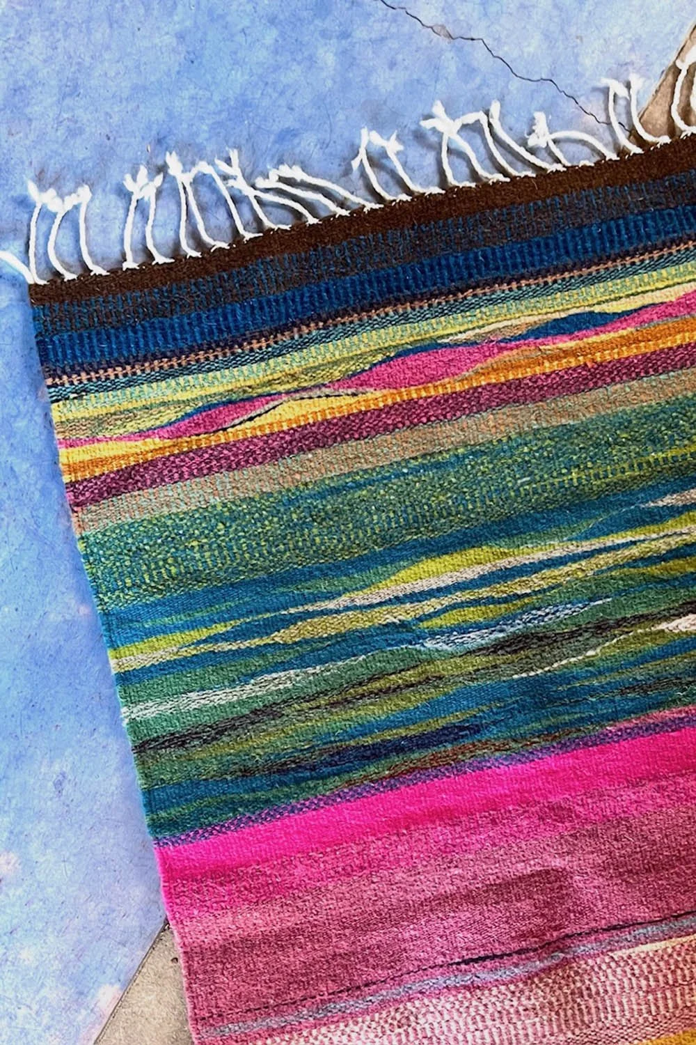 Colorful small wool rug handwoven in Oaxaca