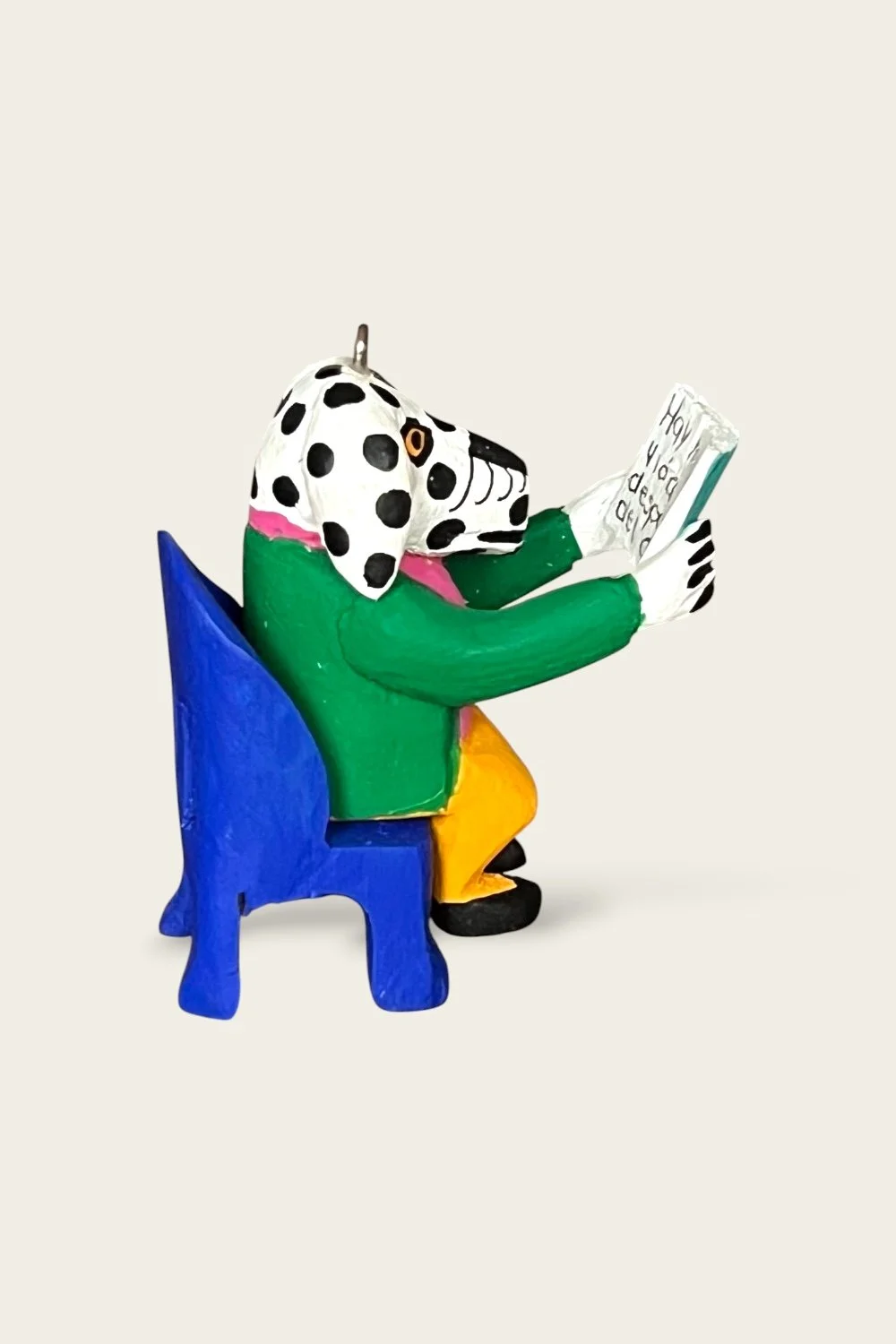 Carved Oaxacan reading dog ornament