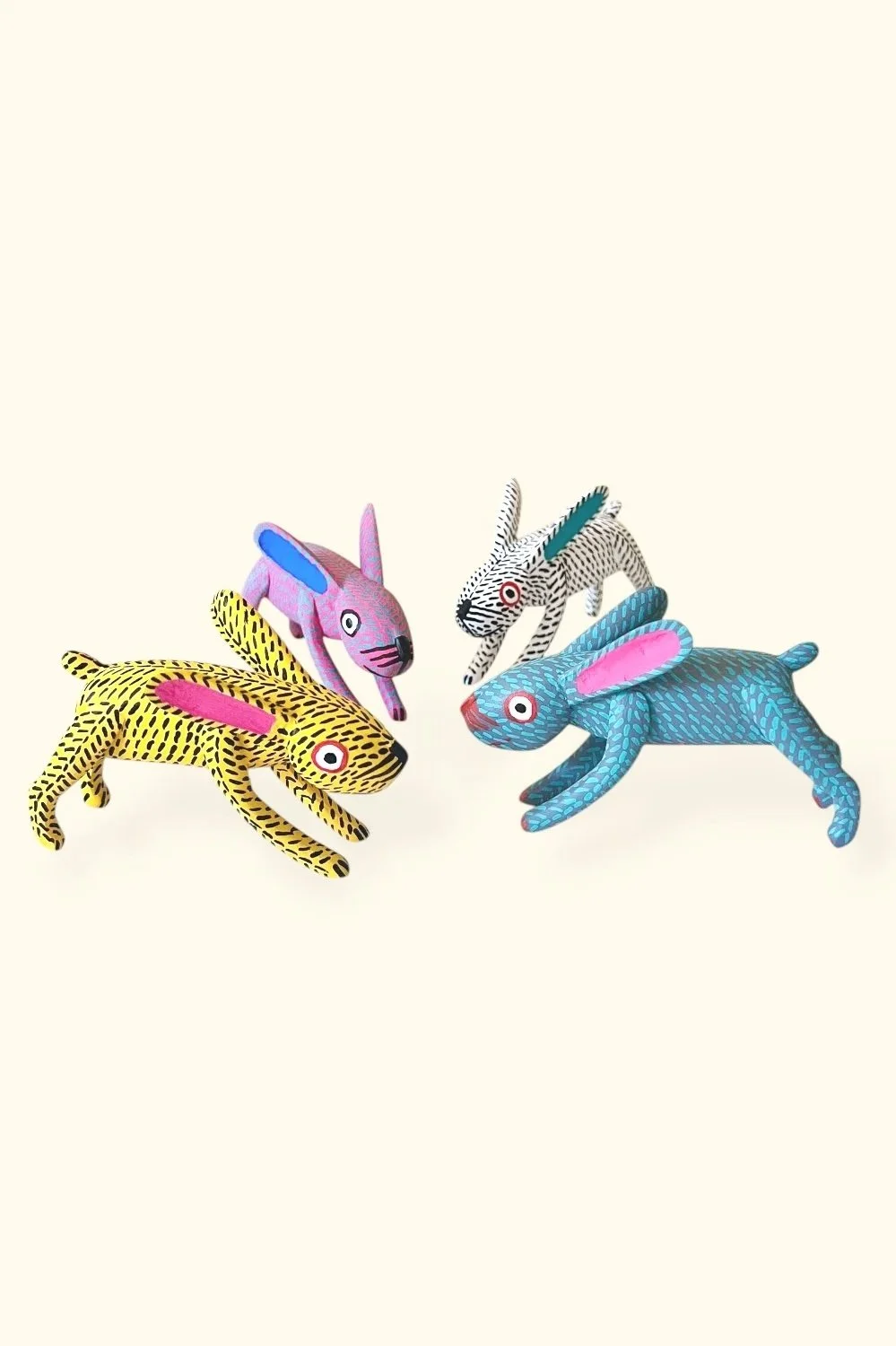 Carved wood Oaxacan running bunnies