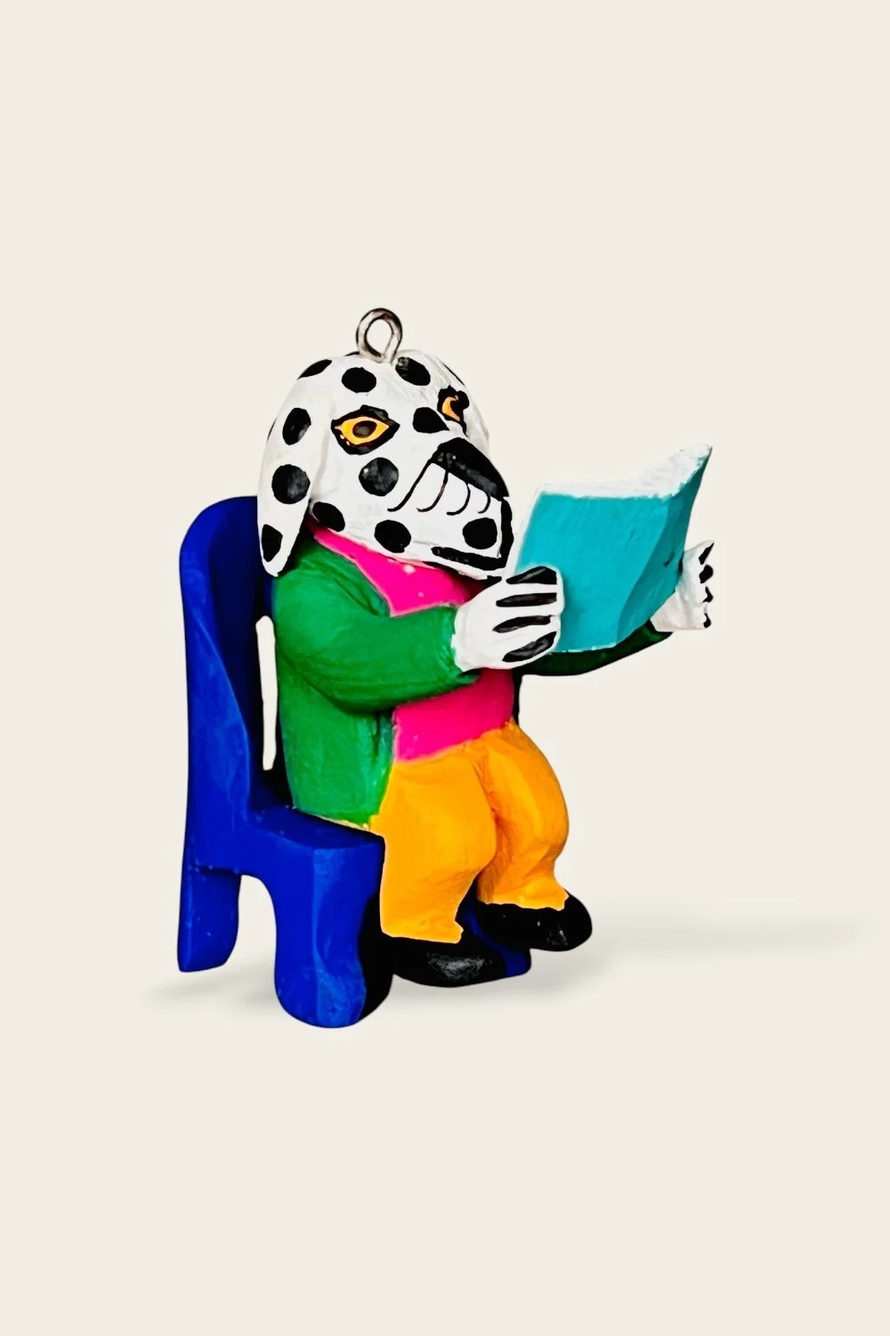 Carved reading dog ornament