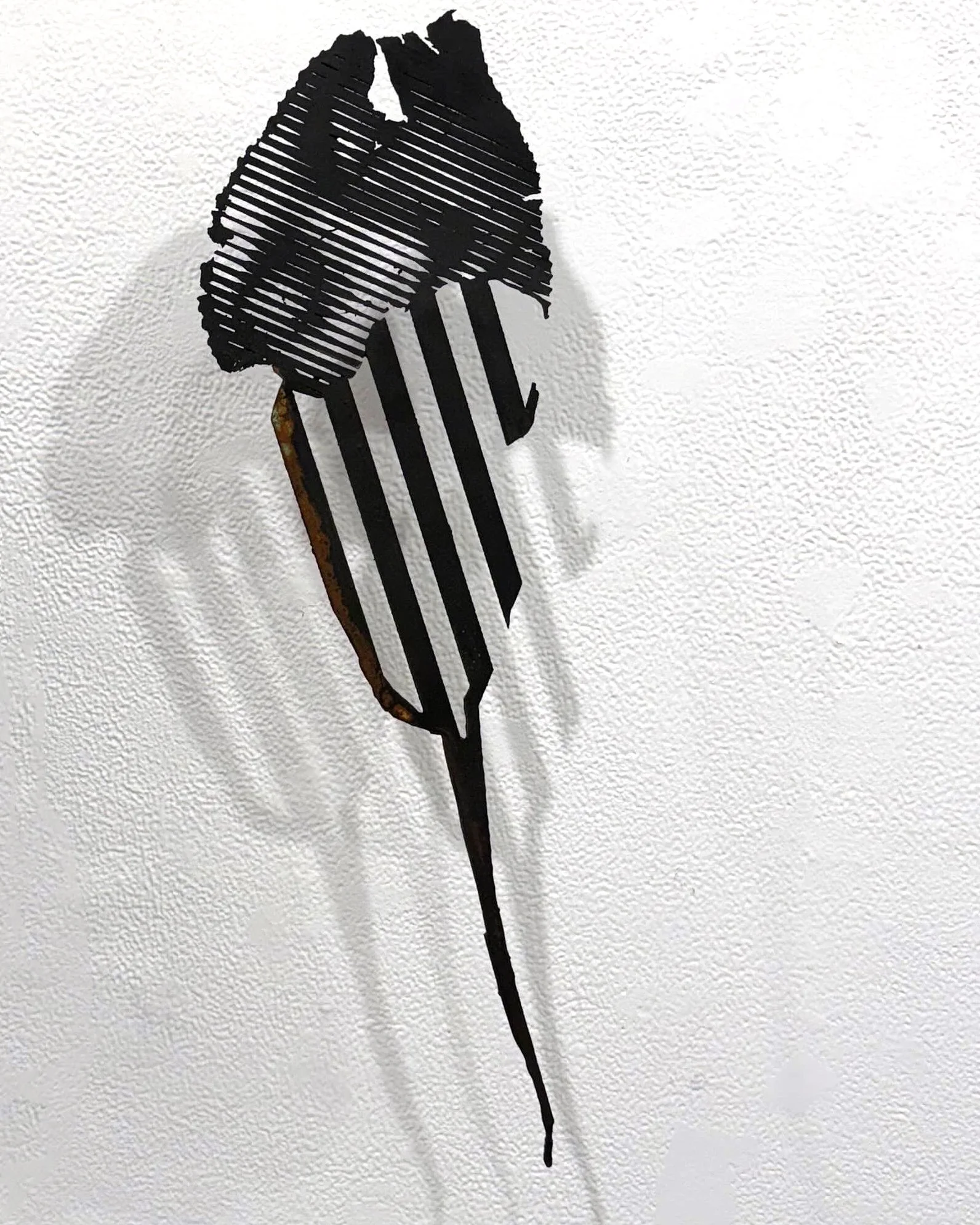  Jon Roberts, “Scrap Series: Bloom,” 2025. Iron and copper coatings on wood, patina 20 × 6 inches. 