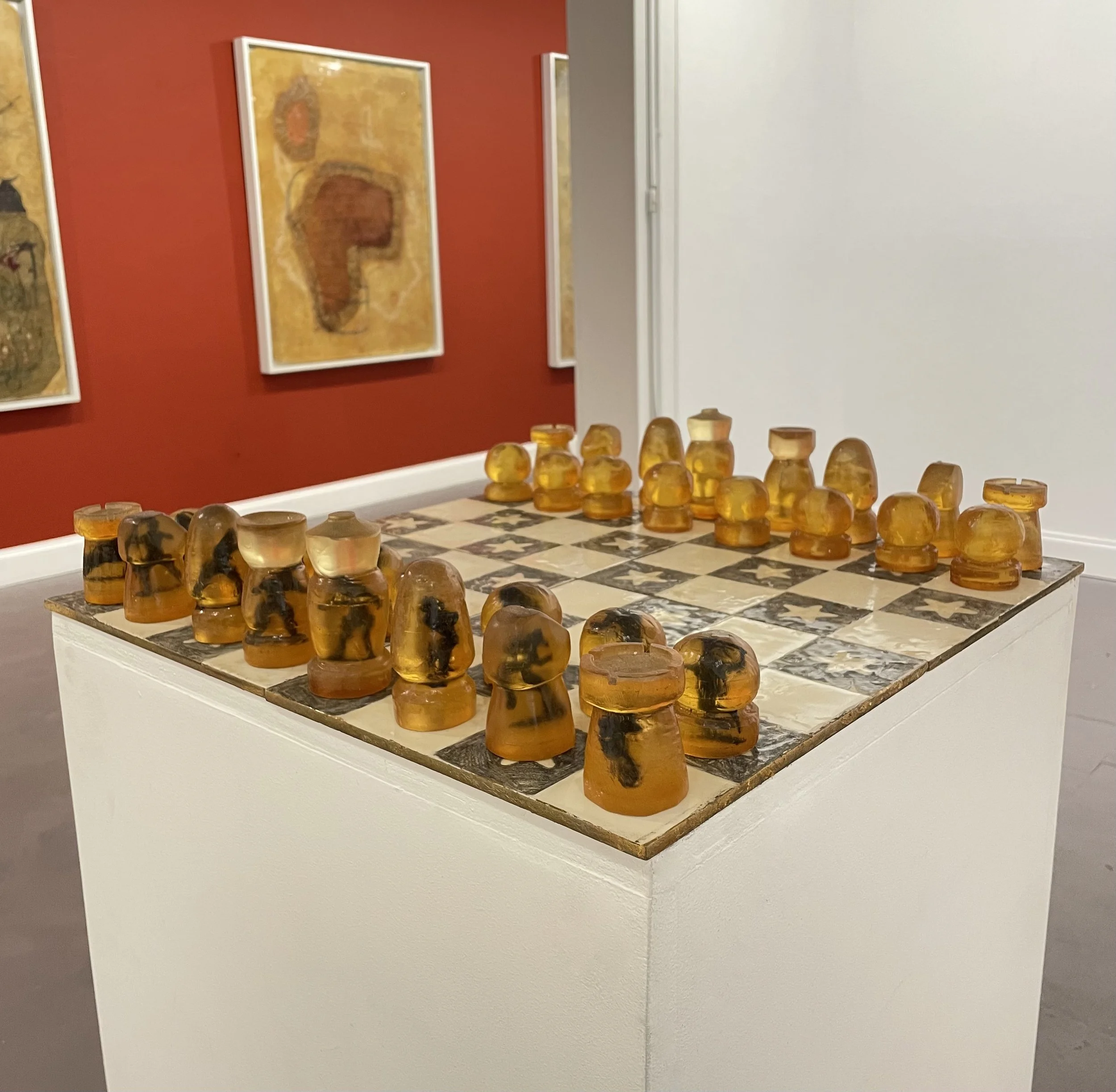    chess set (stars and soldiers)   (ca. 2006) Board: resin, graphite, pigment; four parts combine to make one board. Chess pieces: toy soldiers encased in resin. Board and pieces sold together as a set. Approx. 18 × 18 × 3 inches. 