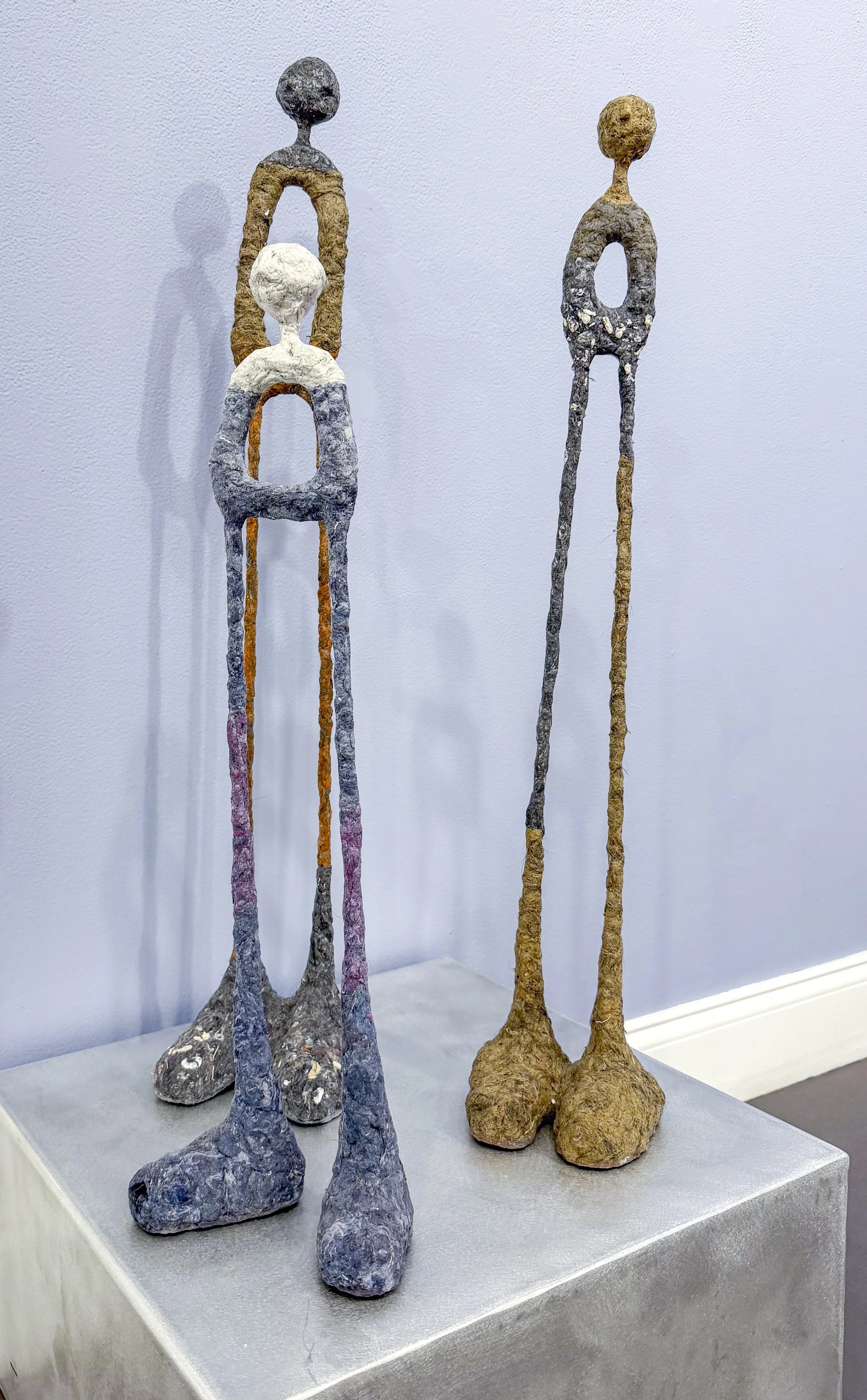  Cheryl Capezzuti,  Five selected bipedal sculptures from the "Stuck" series,  2021. Dimensions vary, Residential Dryer Lint from Mixed Sources.  