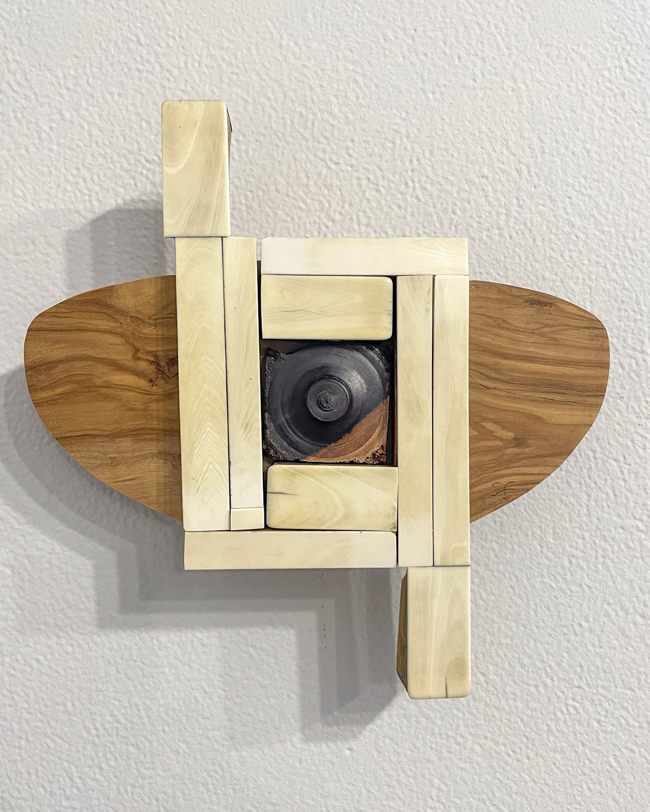  Susan Fuller,  Elephant's Eye,  2025. 8 x 9 x 2 inches. Wood, piano keys.  