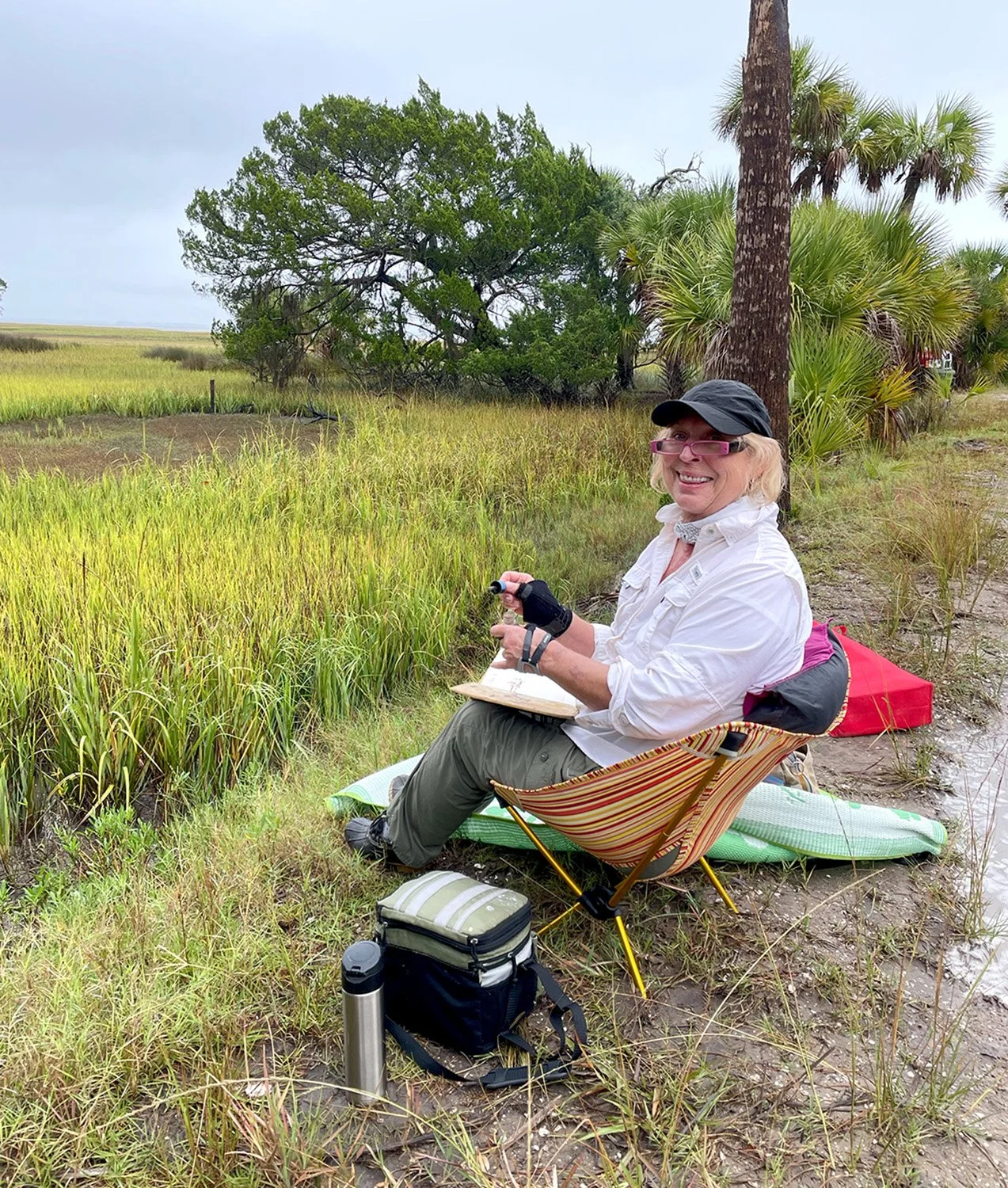 Betsy Cain drawing on the island, Photo by Carmela Aliffi