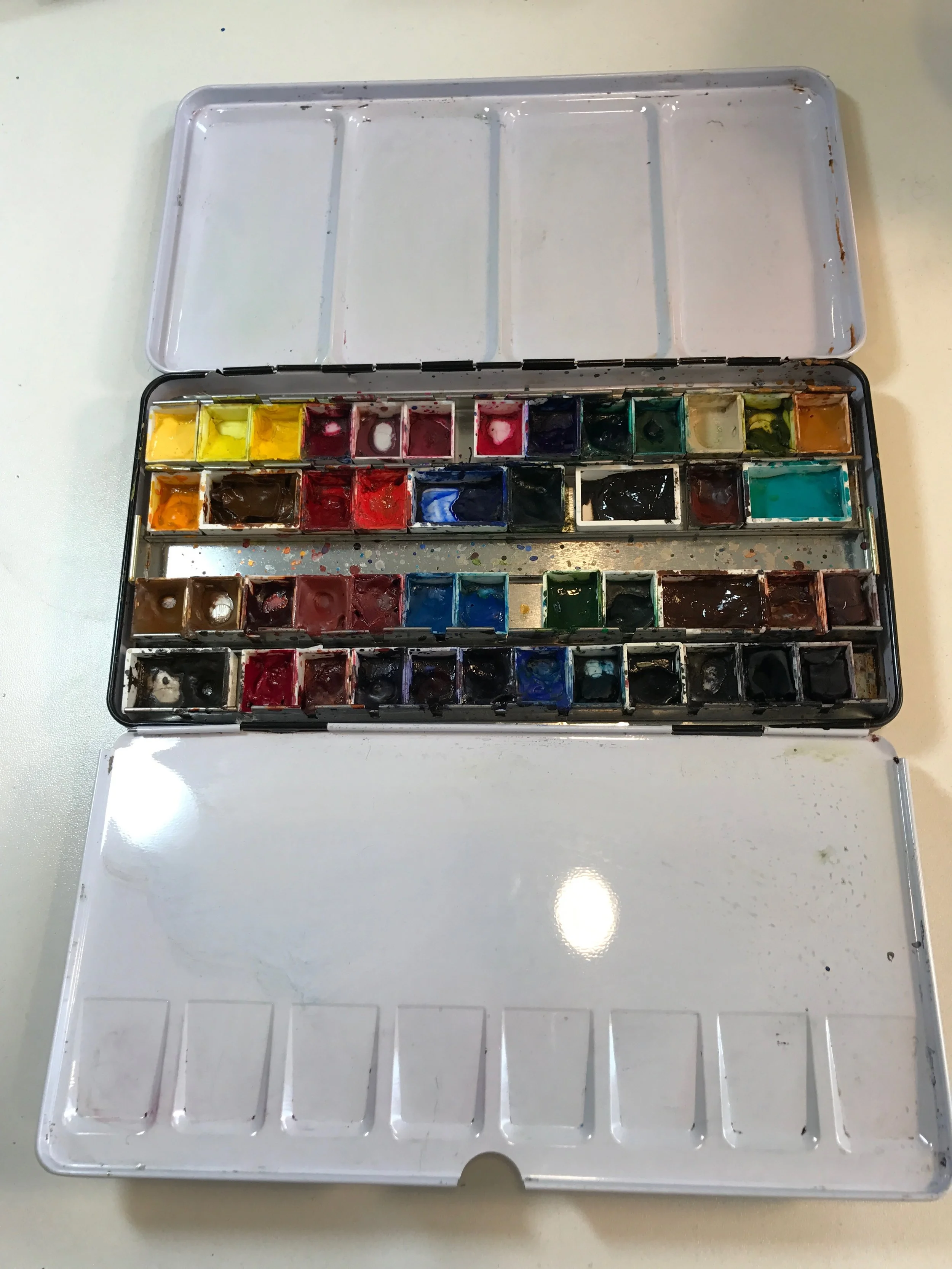 My Daniel Smith watercolors in a 8.5" x 4.5" metal palette that folds out to about 13"