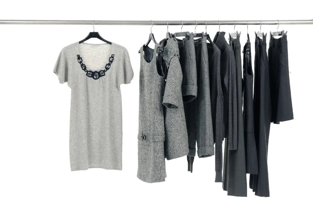 Dry cleaned garments hanging neatly after service in East Elmhurst NY dry cleaners