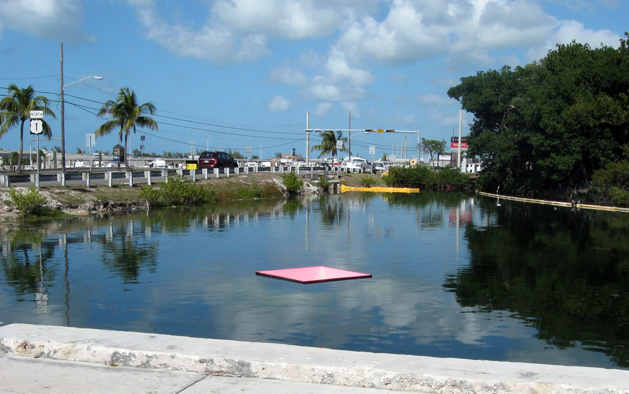   Displacement 2009 painted steel,&nbsp;buoyancy weights, waterbody 5' x 5' x 5'   Displacement uses over 13000 pounds of weight to create a vibrantly colored negative space in the surface of a pond. The piece was installed for Sculpture Key West 200