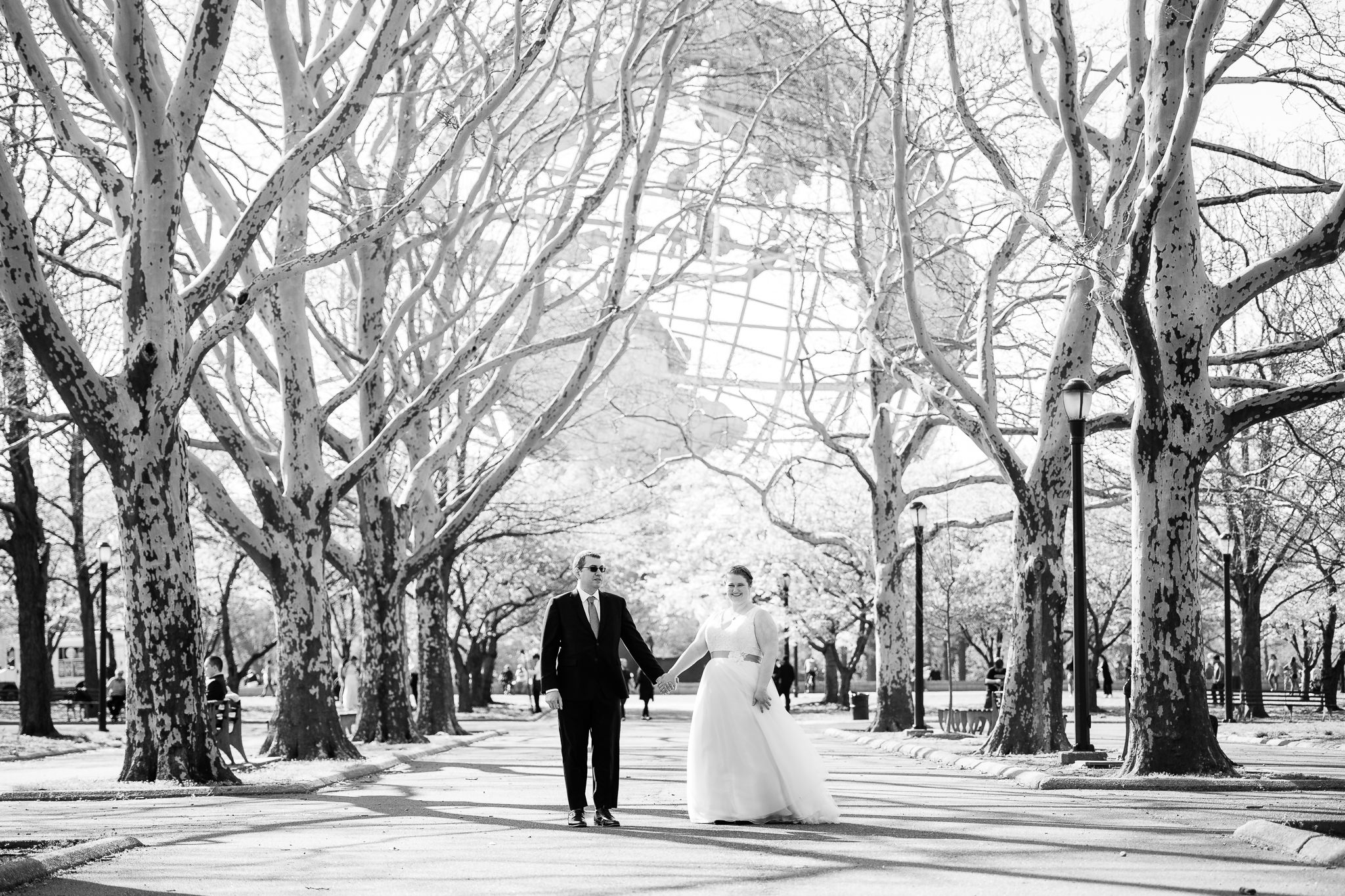 bride and groom in front of the worlds fair globe in flushing meadows corona park