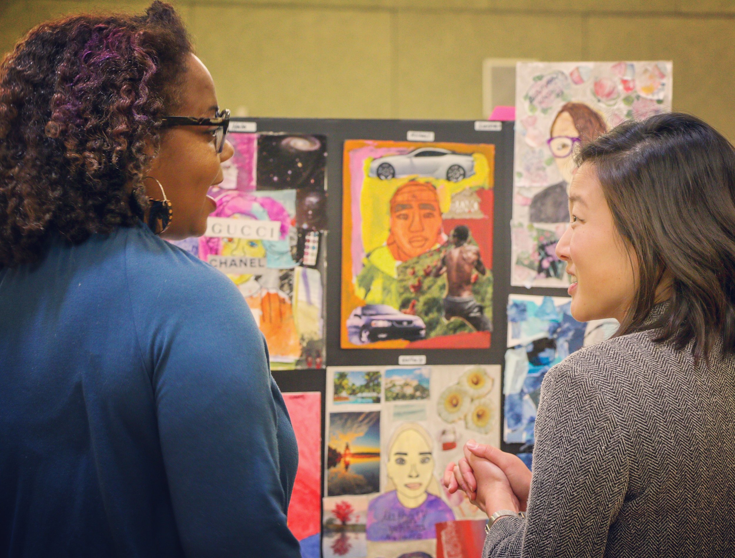 Agency by Design Oakland Fellowship Director Paula Mitchell and Fellow Jane Lee engaging with Fellow Kristen Vetterlein’s documentation booth entitled “Practicing Self-Reflection and Developing Agency Through Art!”