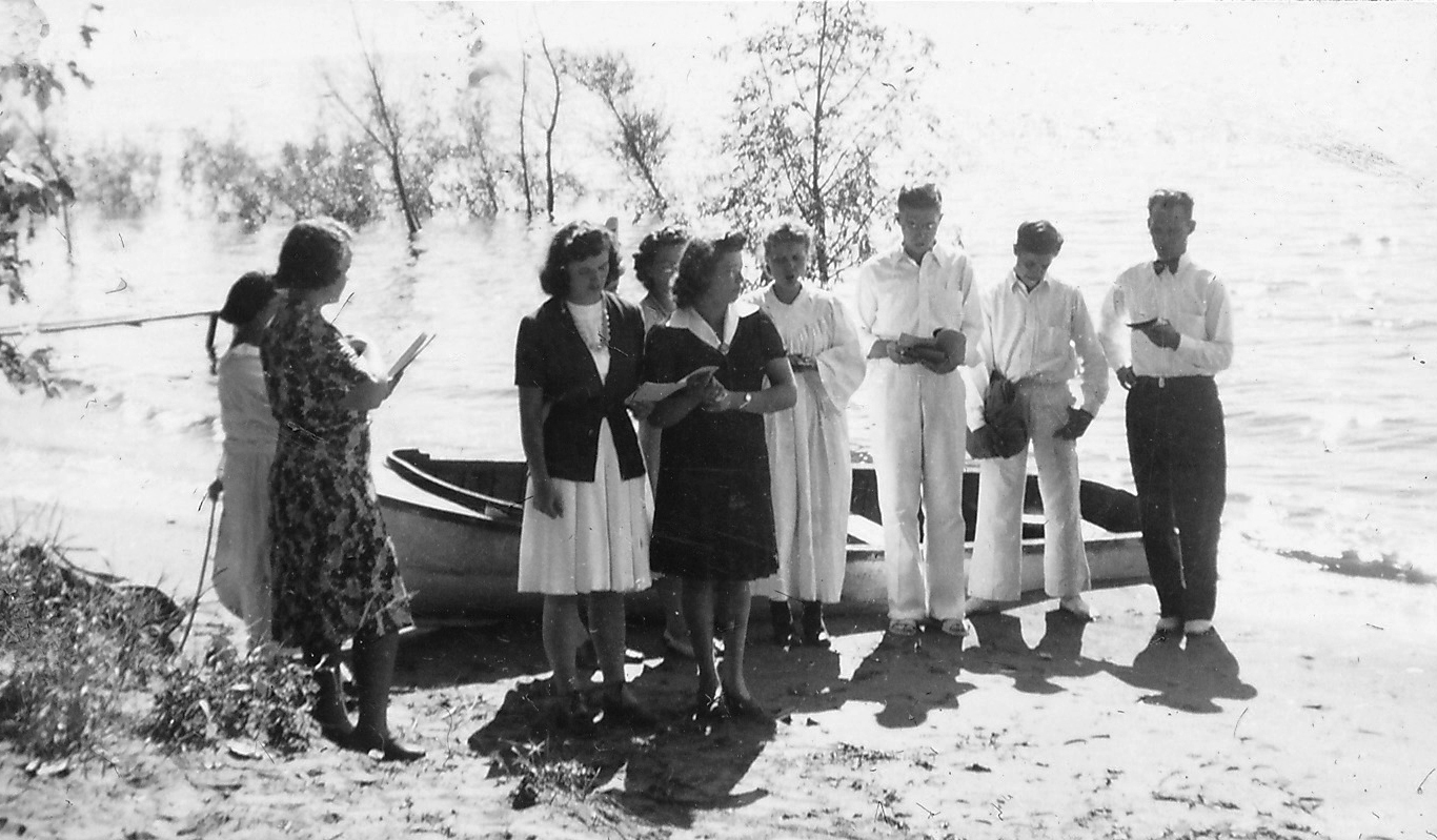 Ernie Rockstad about to baptize a very special person, his wife Ilene Dixon Rockstad, during the summer of 1943.