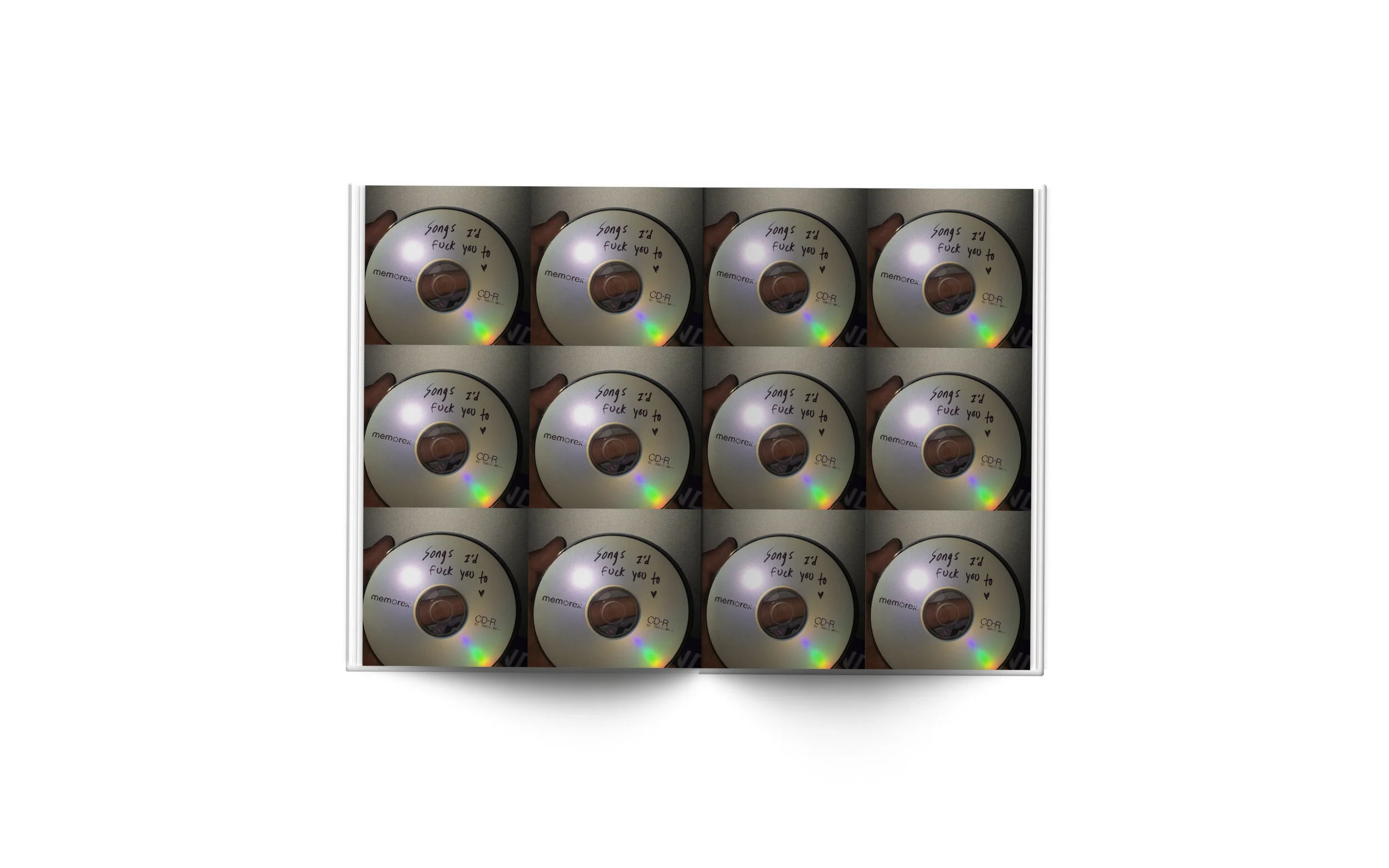 A box of twelve CDs with a handwritten note on each that says, 'Songs I'll fuck you to' and a small heart symbol.