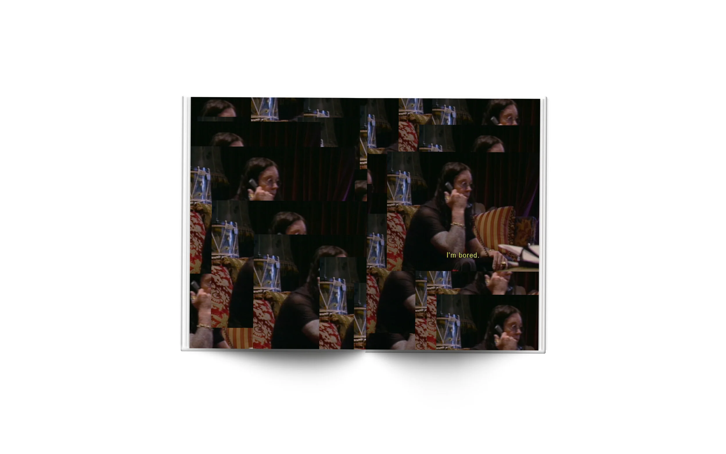 Open book showing a woman with dark hair, glasses, wearing a black top, sitting on a patterned couch, talking on a phone, with a subtitle that reads 'I'm bored.'