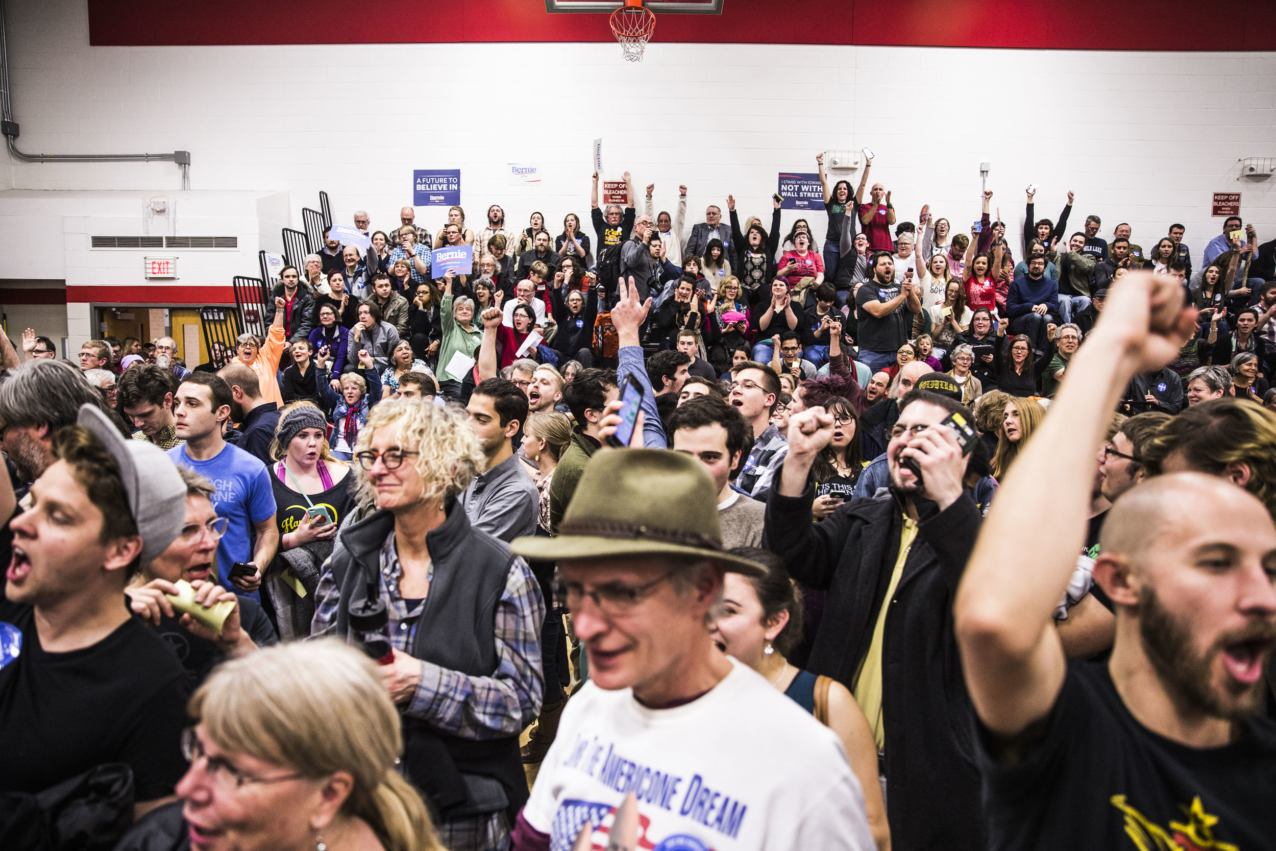 Bernie Sanders supporters cheer as they win at caucus at their precinct