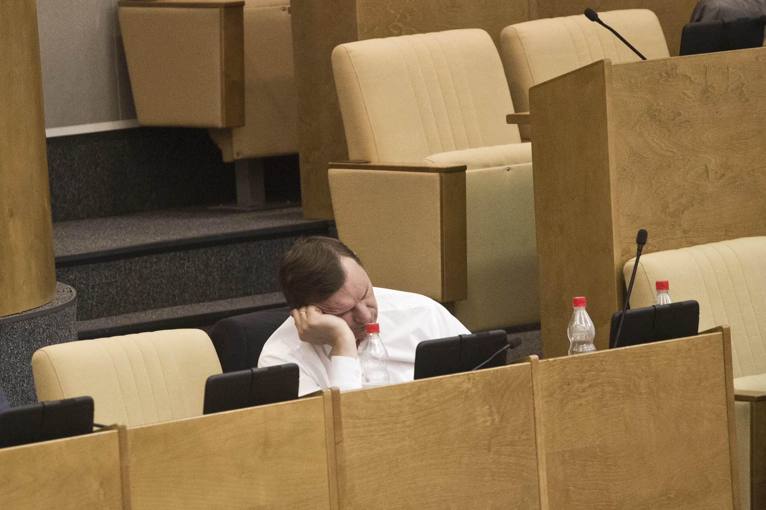 A member of Russian parliament sleeps during a session. June 5, 2012