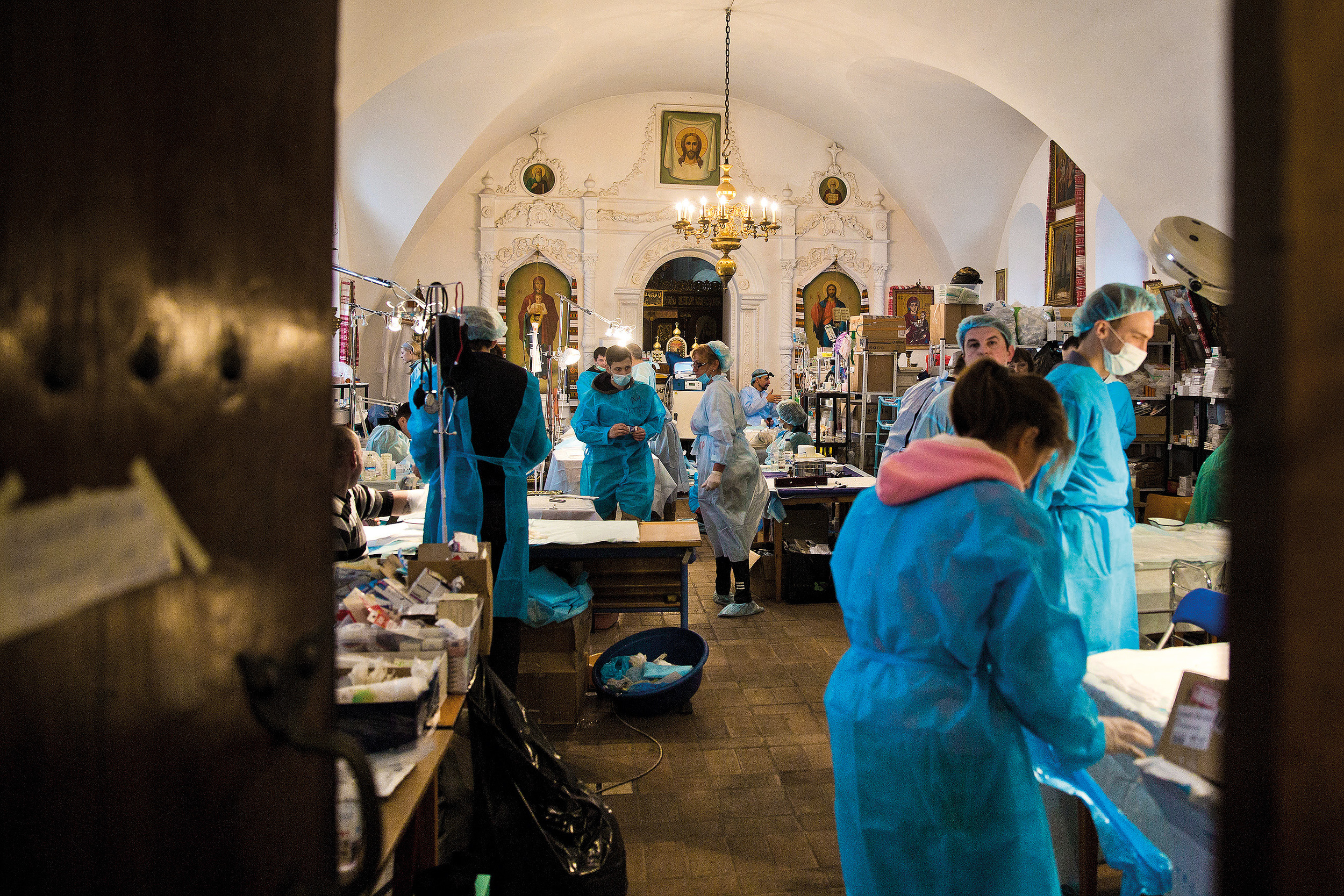  Volunteers help as doctors in the hospital organized in Kyiv's Mikhailovsky monastery after almost 100 protesters were killed with snipers' fire and hundreds were wounded 