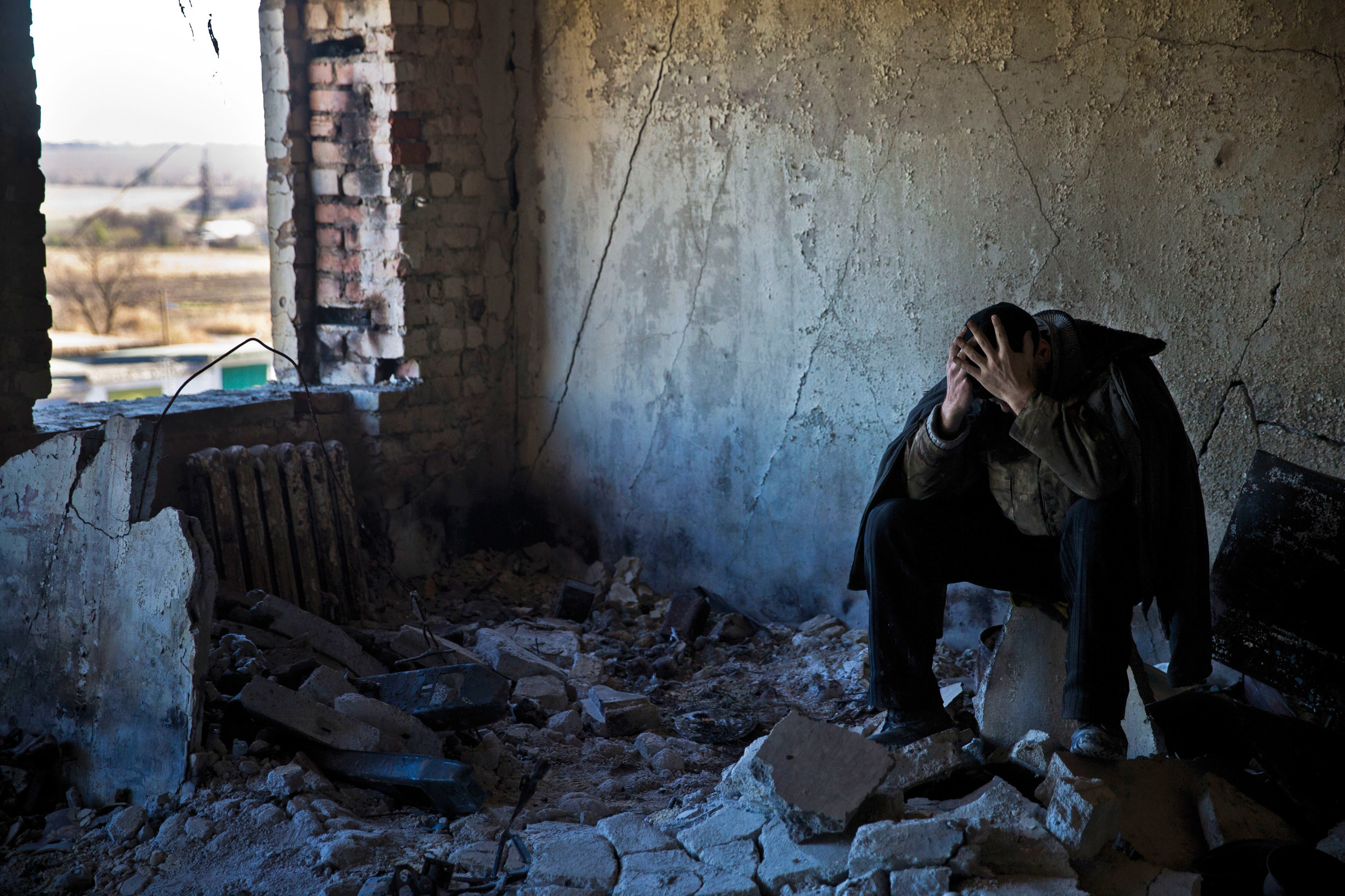  Ukrainian soldier reflects as he is forced for labour among other prisoners of war in Ilovaysk 