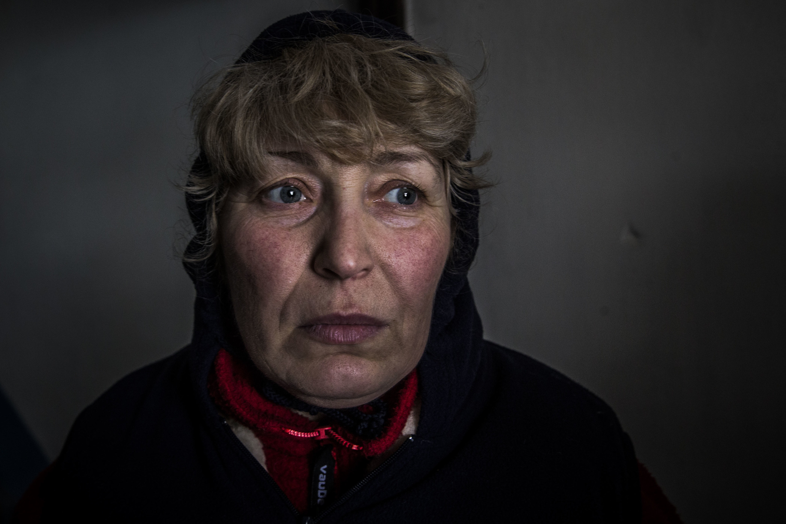  A woman is seen hiding in a basement as Debaltsevo comes under heavy fight from separatists' side 