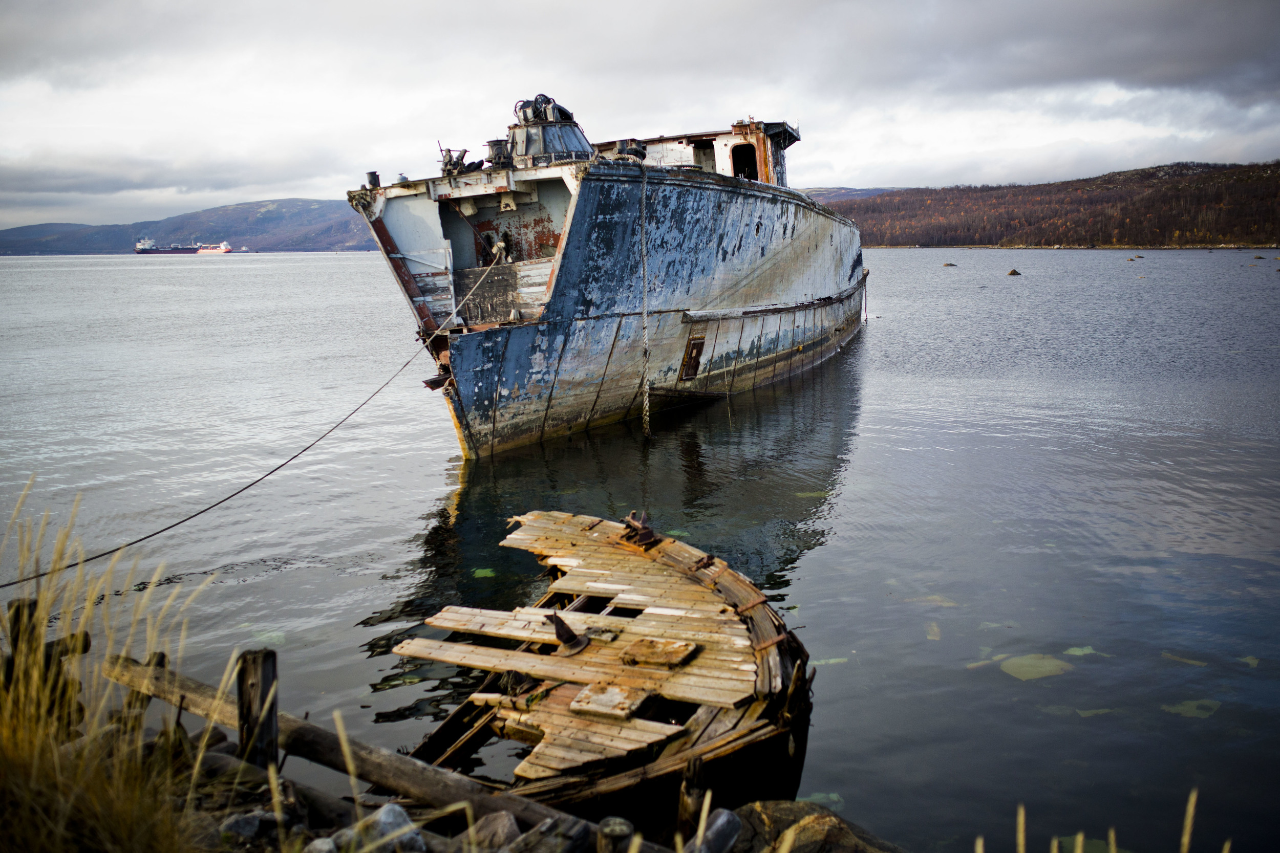An abandoned ship rests in waters of Kola Bay, Russia. October 9, 2013