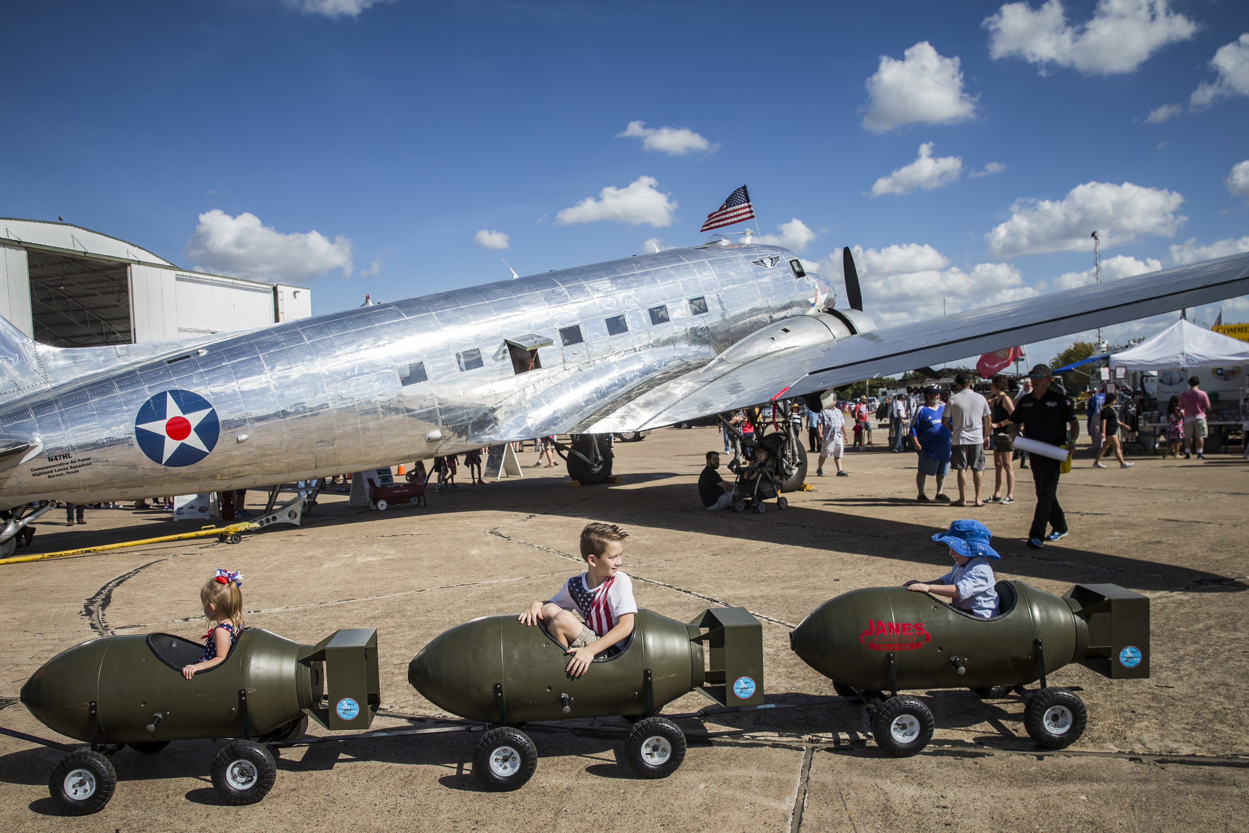  Children ride a bomb-shaped auto-train at an air show in Dallas, Texas 