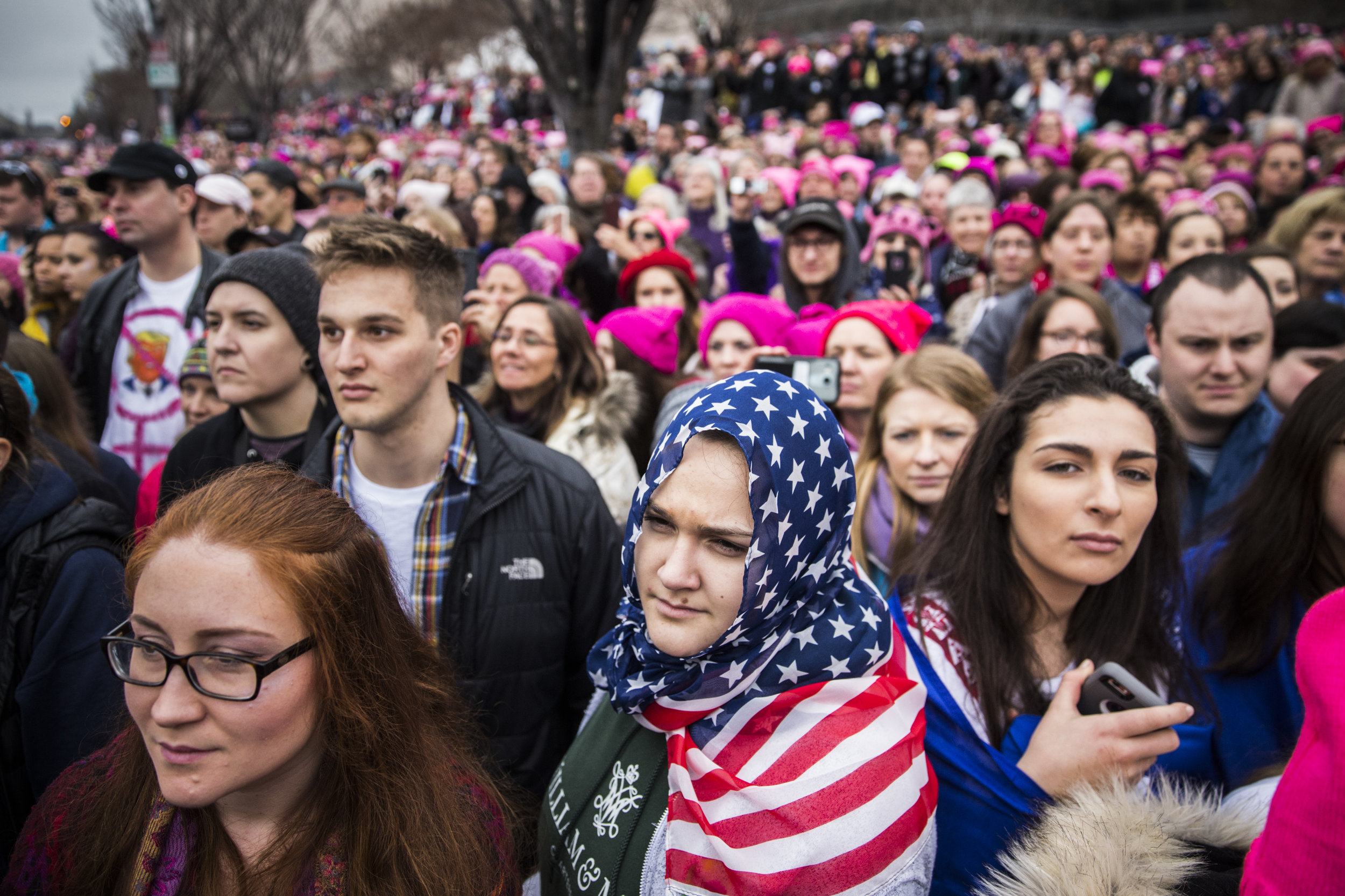  A protester wearing an American flag as a hijab stands amidst the crowd at Women's March on Washington 