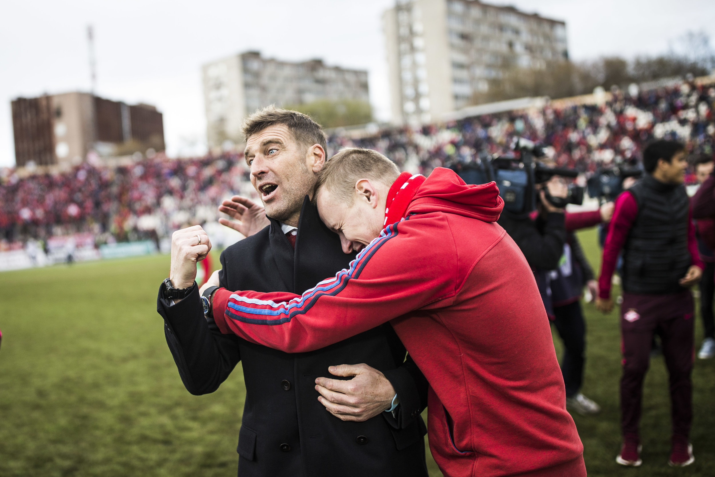  Spartak Moscow fan, who ran off the stands onto the pitch, hugs team's head coach Massimo Carrera after a league game in Perm. A few days ago Spartak became the league champion for the first time in 16 years. May 13th, 2017 