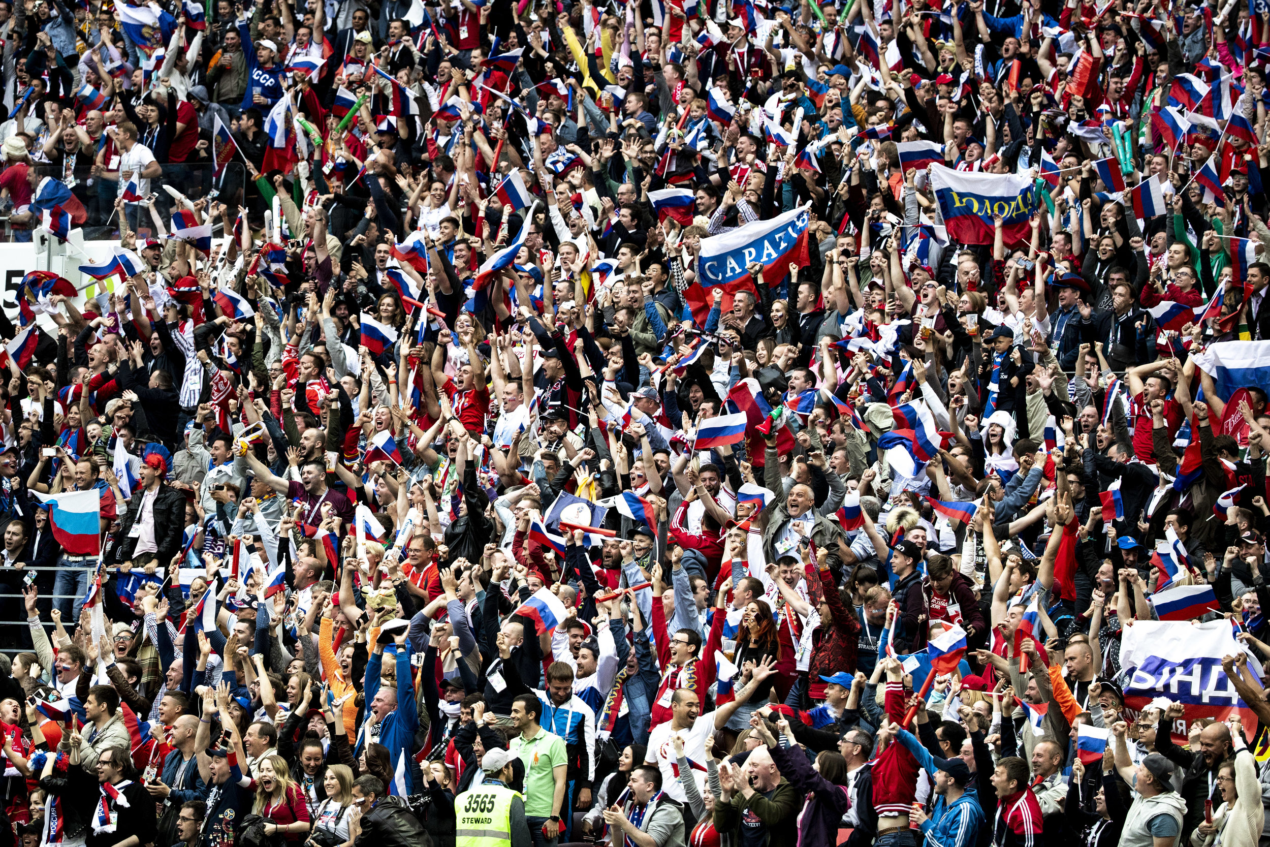 Russian fans celebrate their team's second goal against Saudi Arabia in the World Cup opening game in Moscow