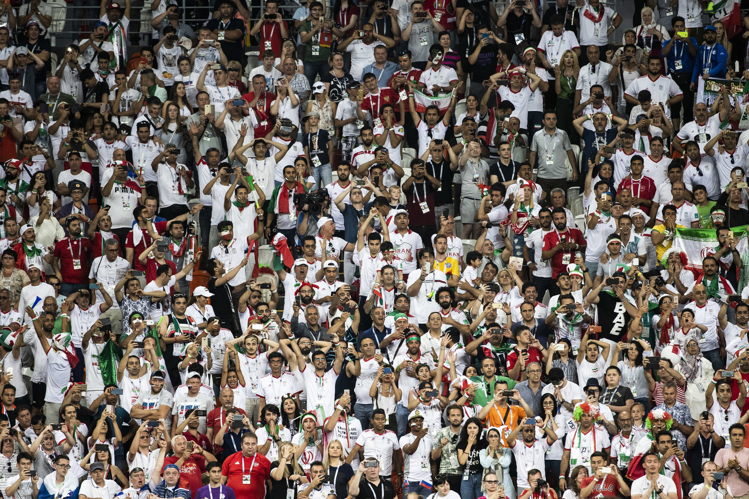 Iranian fans are seen on the last minutes of a nail-biting draw game against Portugal in Saransk
