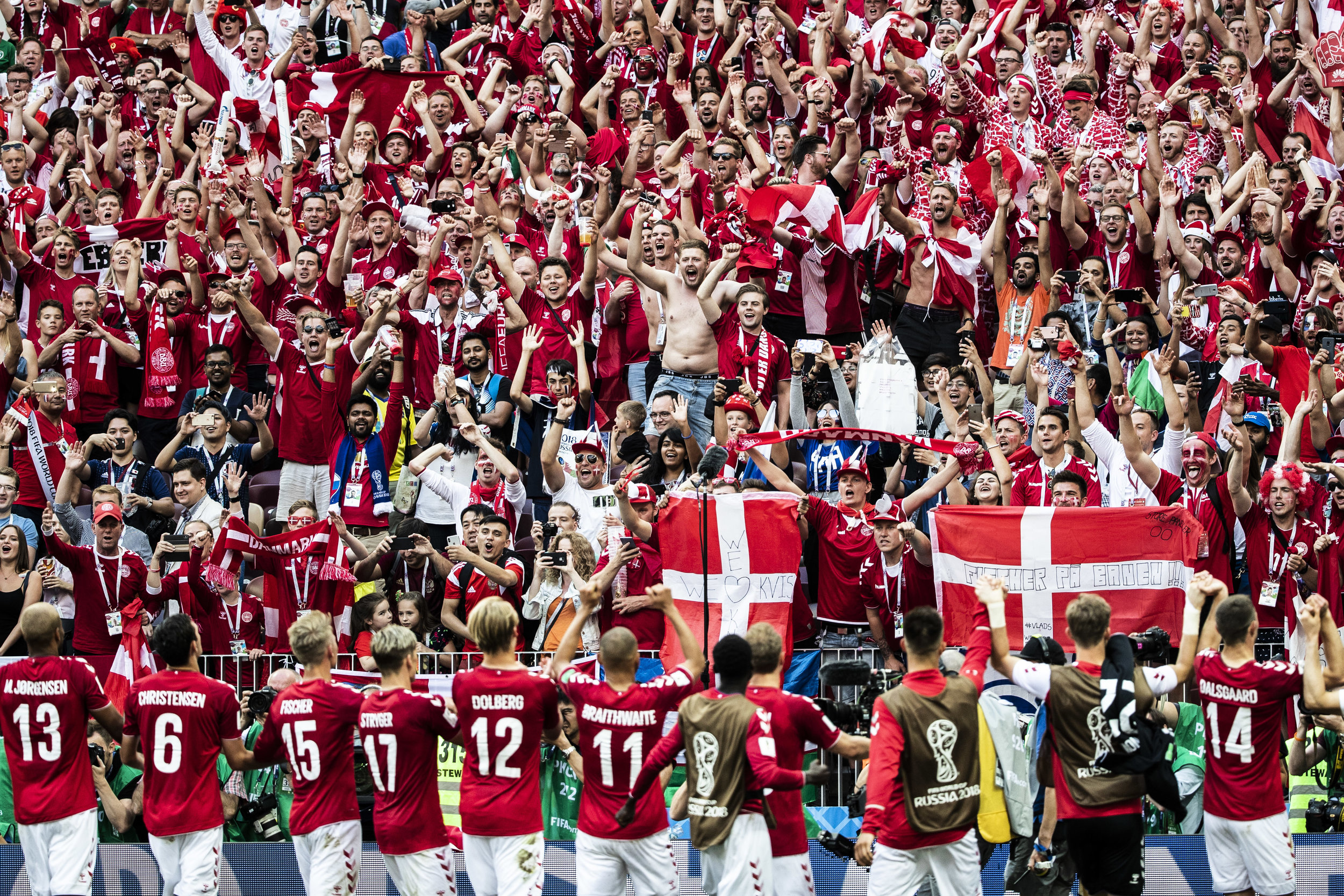 Danish fans celebrate with their team as it passed into play off stage of the World Cup after a draw versus France in Moscow 