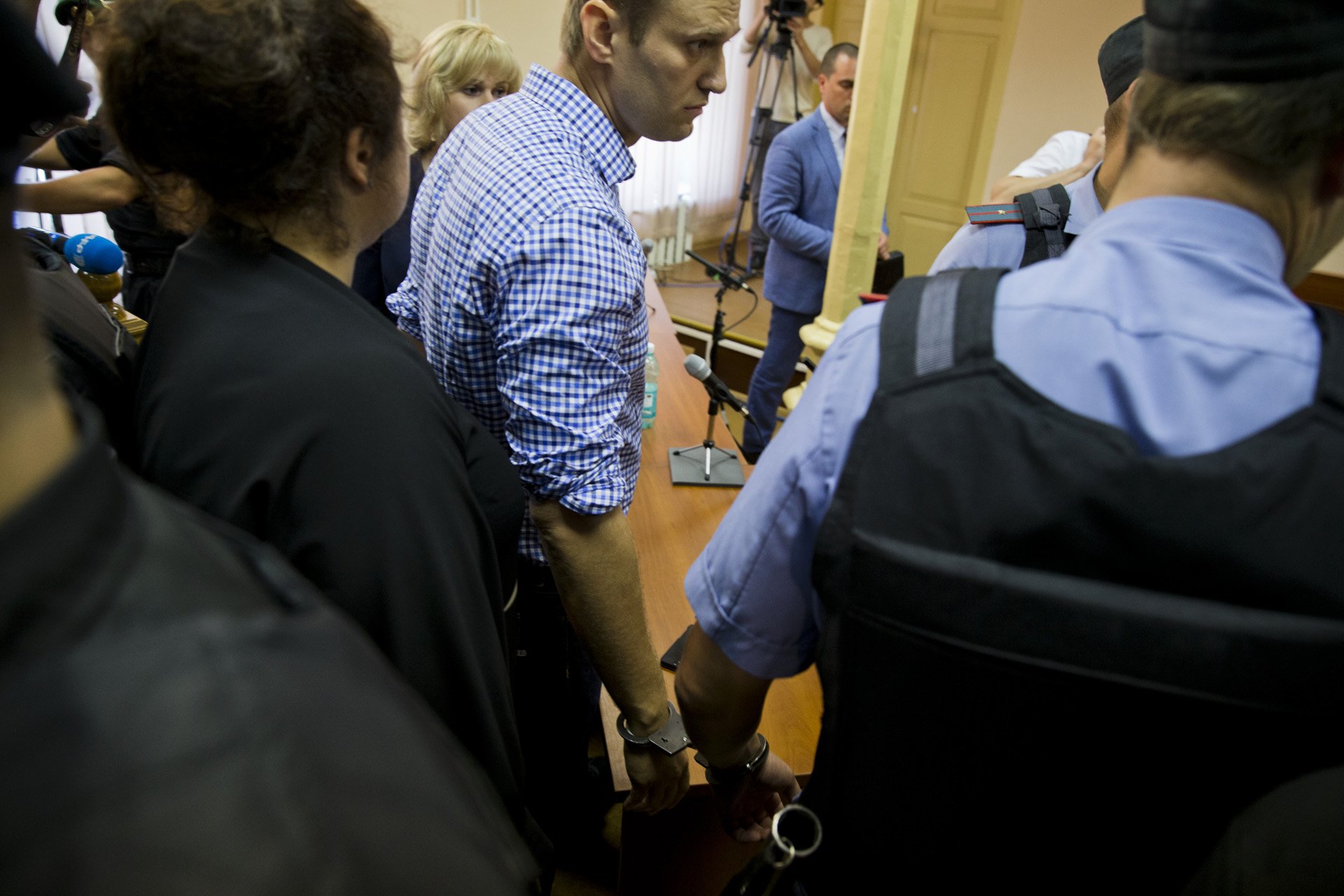  Alexey Navalny is being taken in custody in Kirov, Russia on July 18, 2013. A local court in Kirov found him guilty on embezzlement charges that were widely seen as trumped up. Navalny was arrested immediately but released the next day after protest