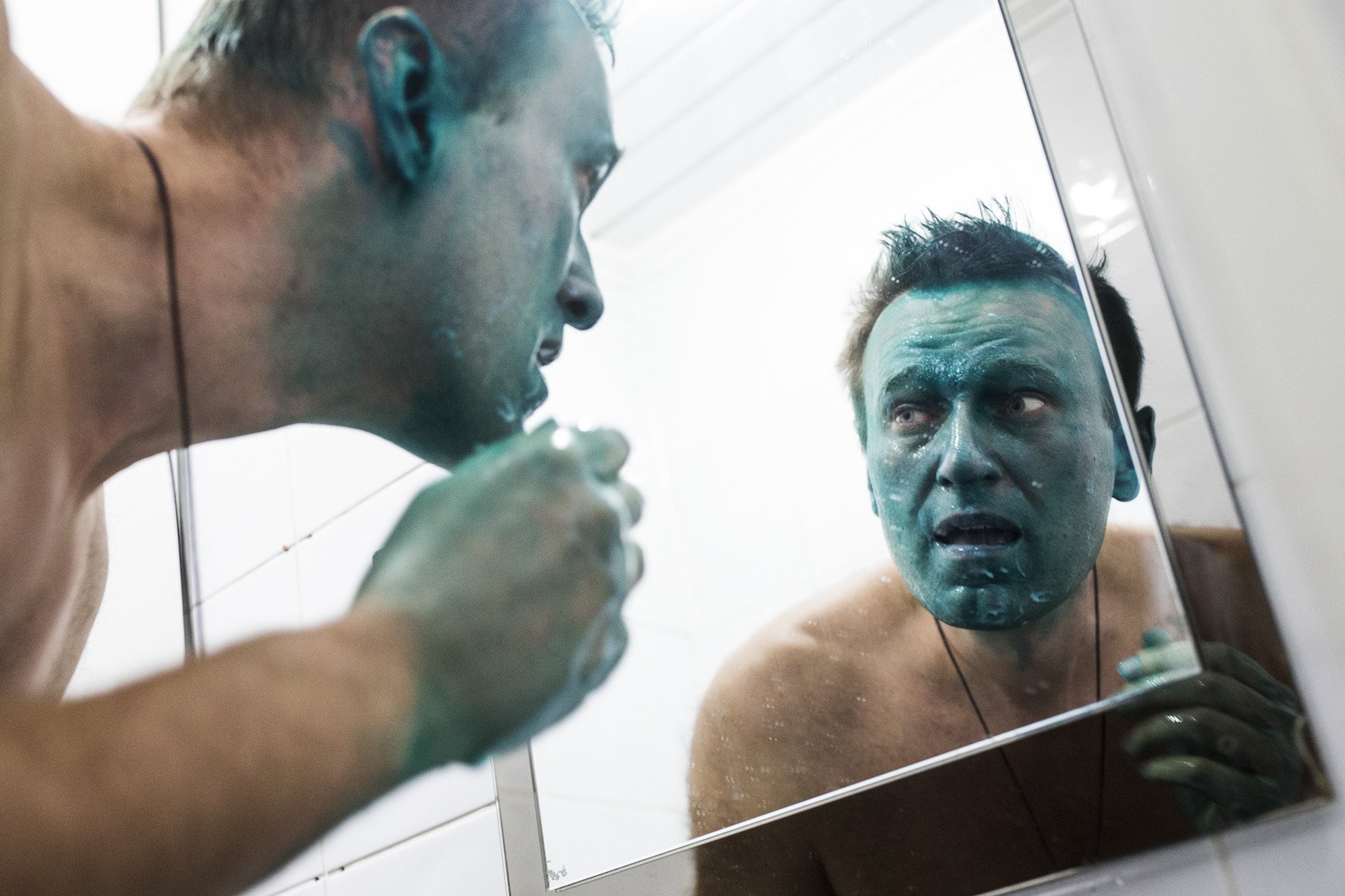  Alexey Navalny, frightened, looks in the mirror after he was attacked with a caustic green liquid in Barnaul, Russia on March 20, 2017. From the beginning of his campaign, Navalny was constantly attacked by locals allegedly tied to the government. L