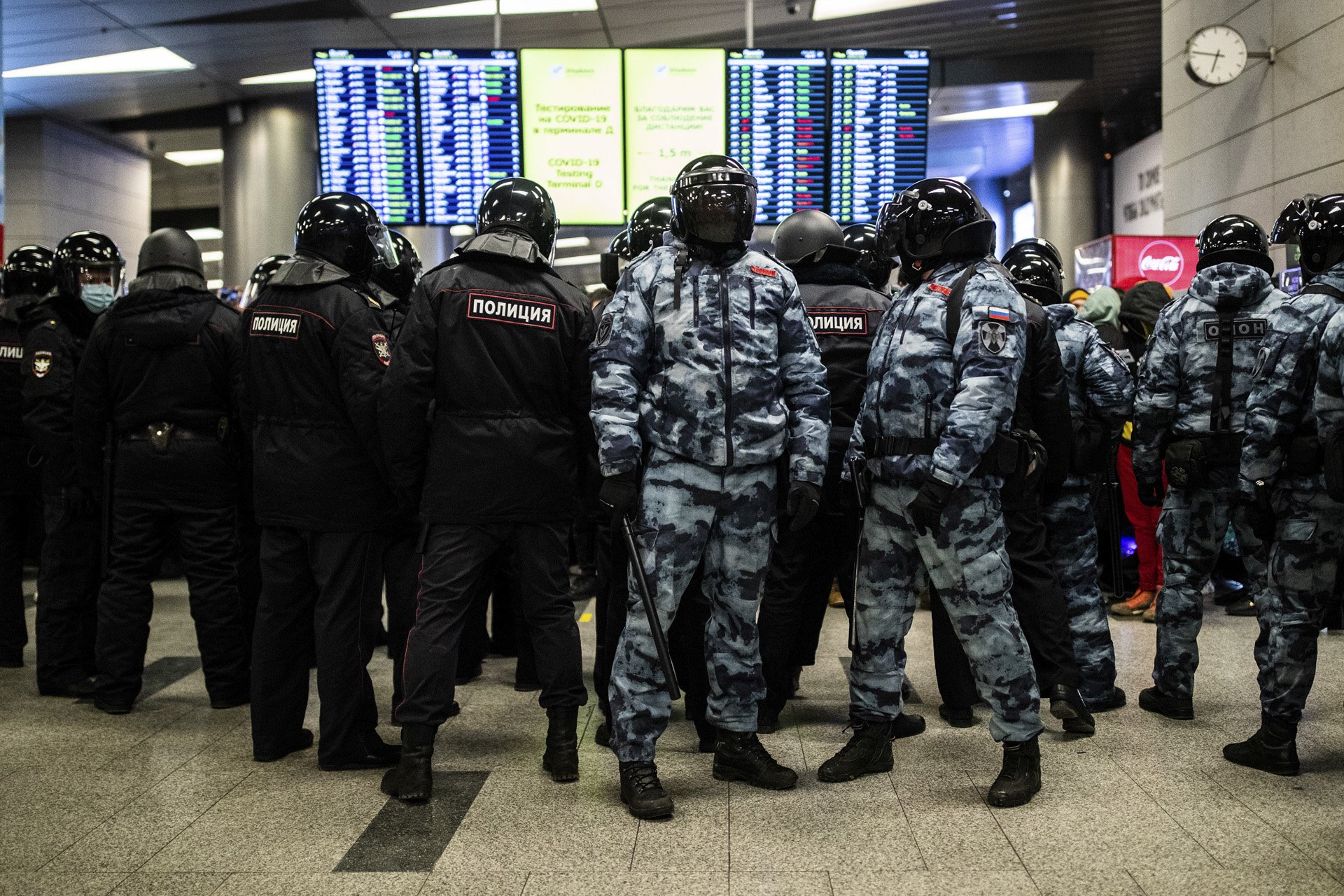  Riot police officers in full gear stand in the arrival hall of Moscow Vnukovo airport on January 17, 2021. Alexey Navalny was poisoned in August 2020 with Novichok by alleged government agents. He was taken to Germany to be rehabilitated. As it was 