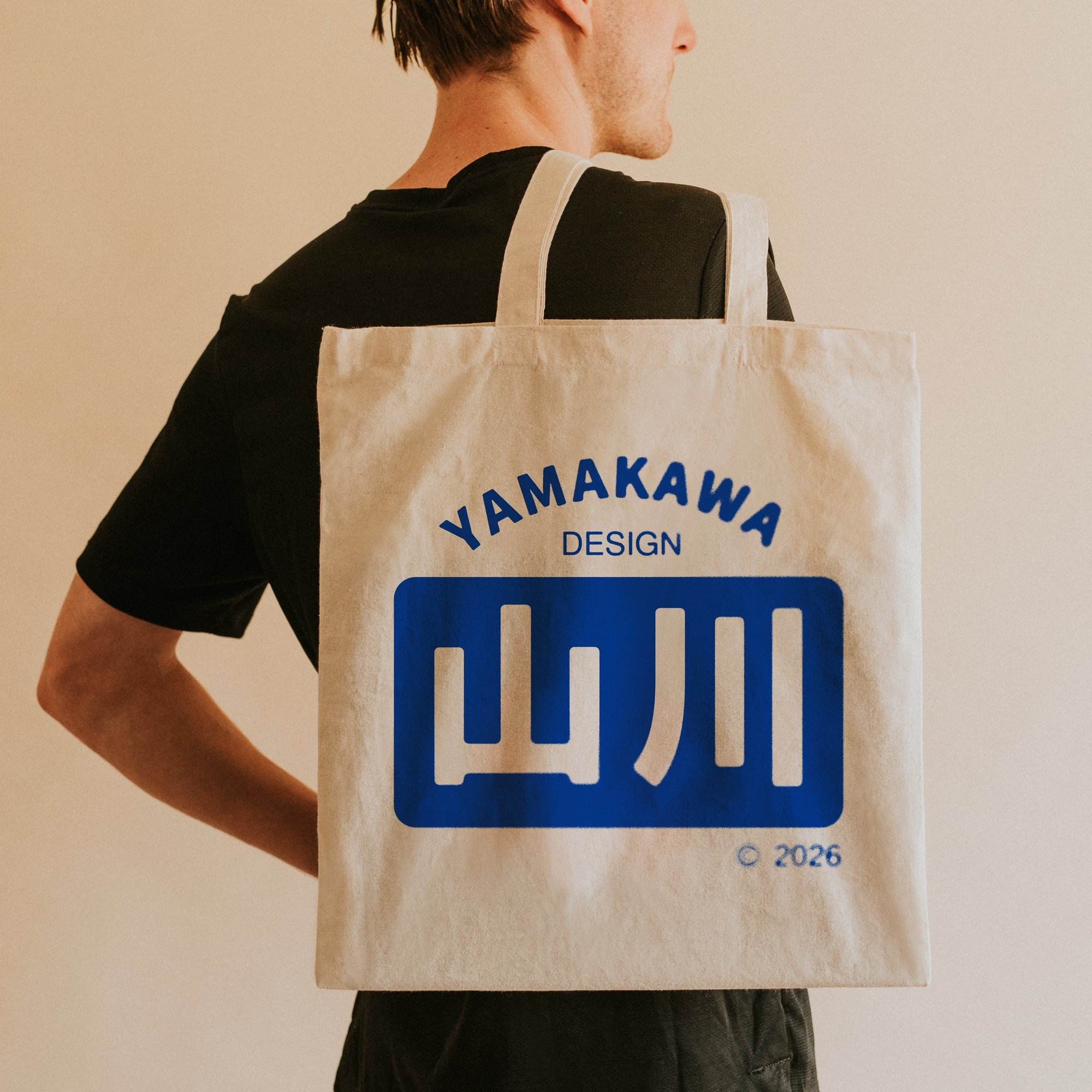back-view-man-carrying-tote-bag-logo.jpg