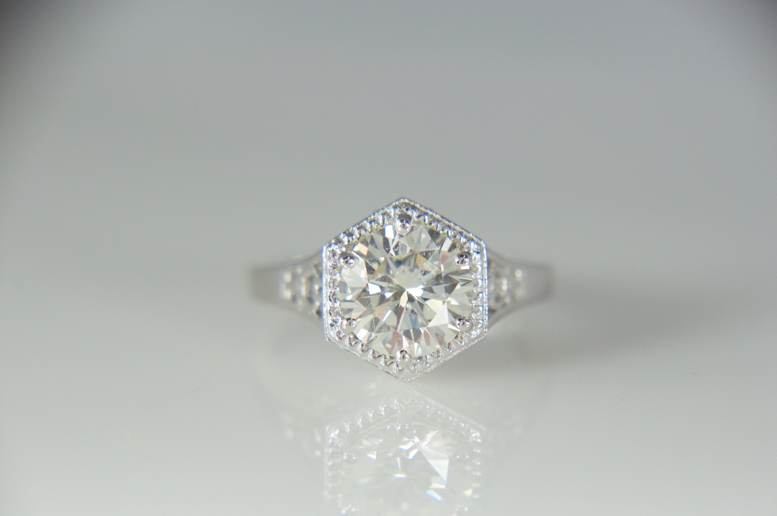 Antique style solitaire engagement ring