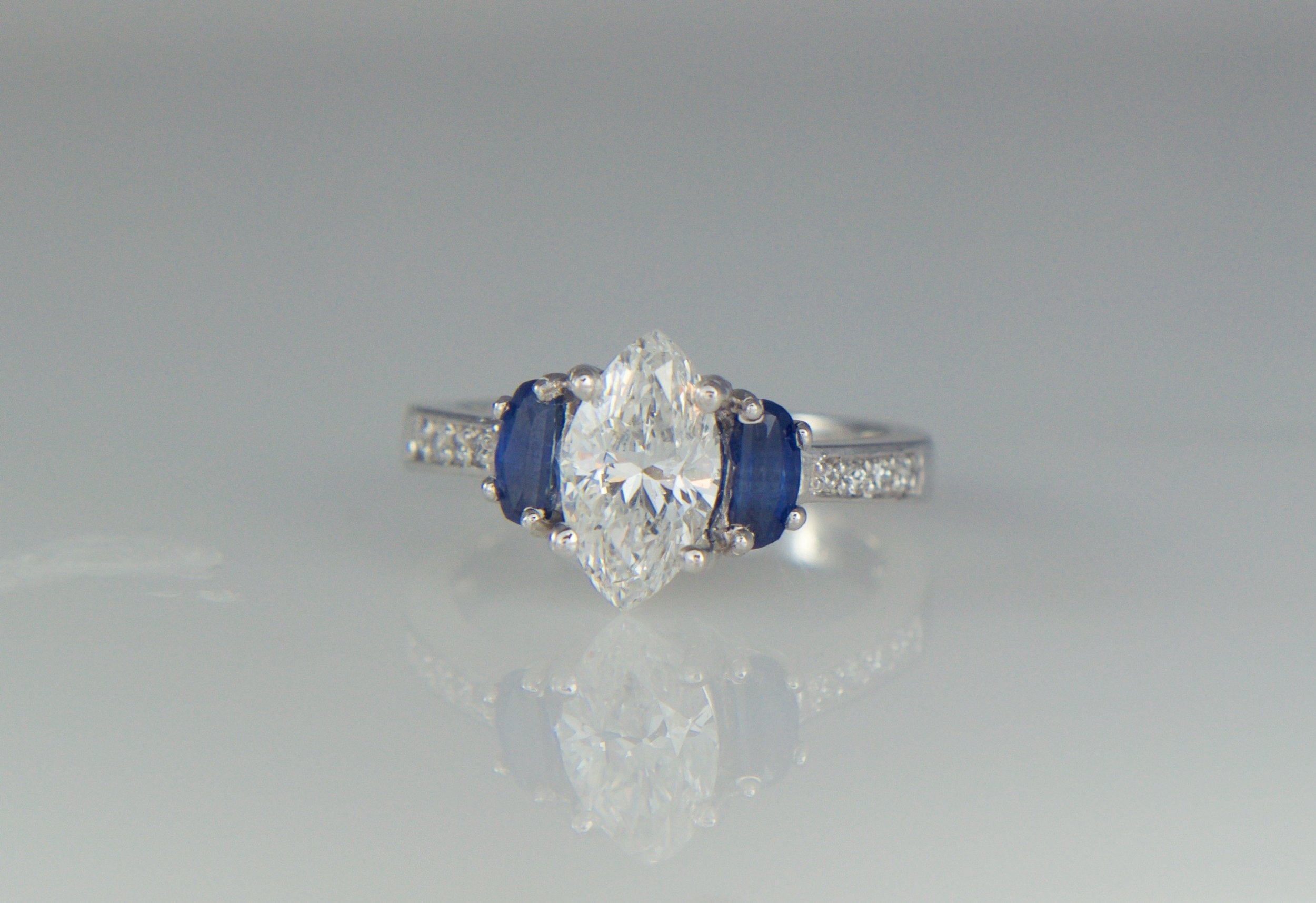 Marquis diamond engagement ring with sapphires