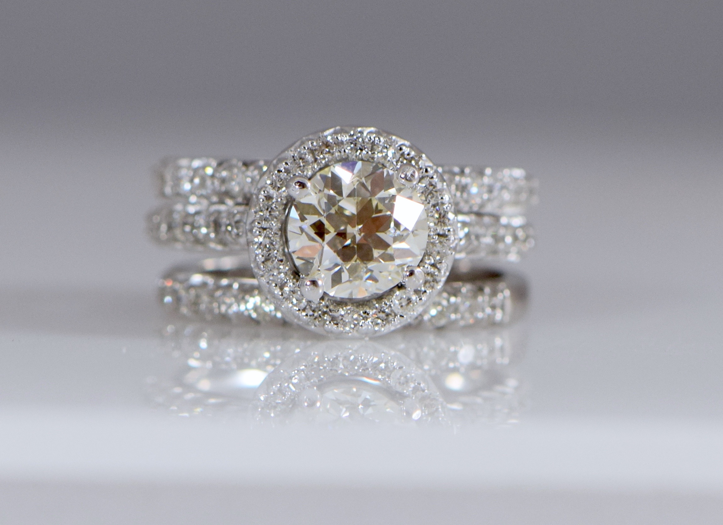 Three ring Round Brilliant diamond halo engagement ring