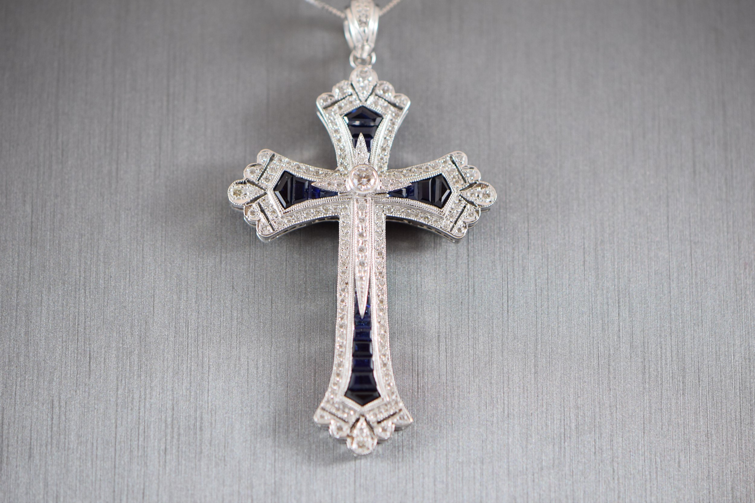 Sapphire and diamond cross pendant