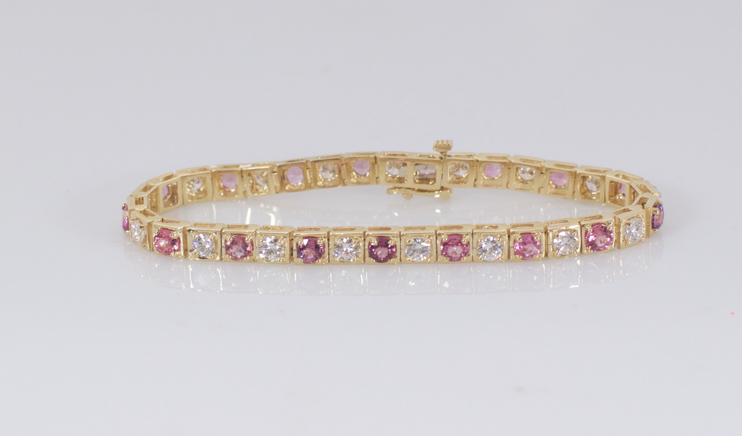 Pink sapphire and diamond tennis bracelet