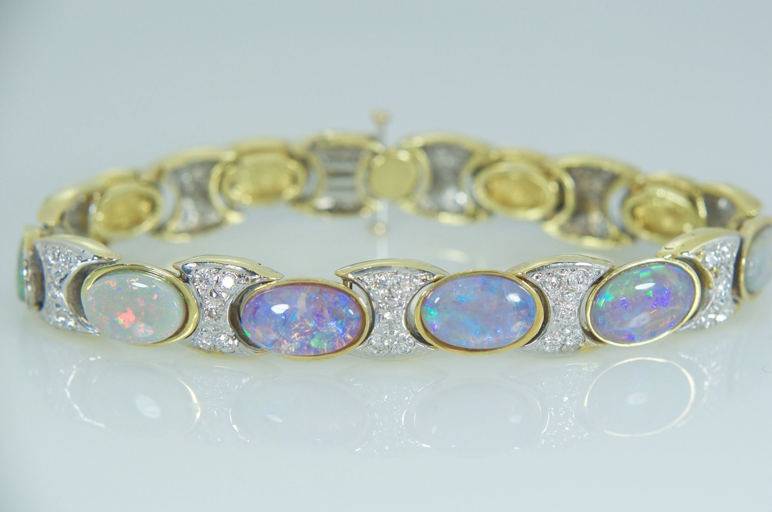Black opal and diamond tennis bracelet