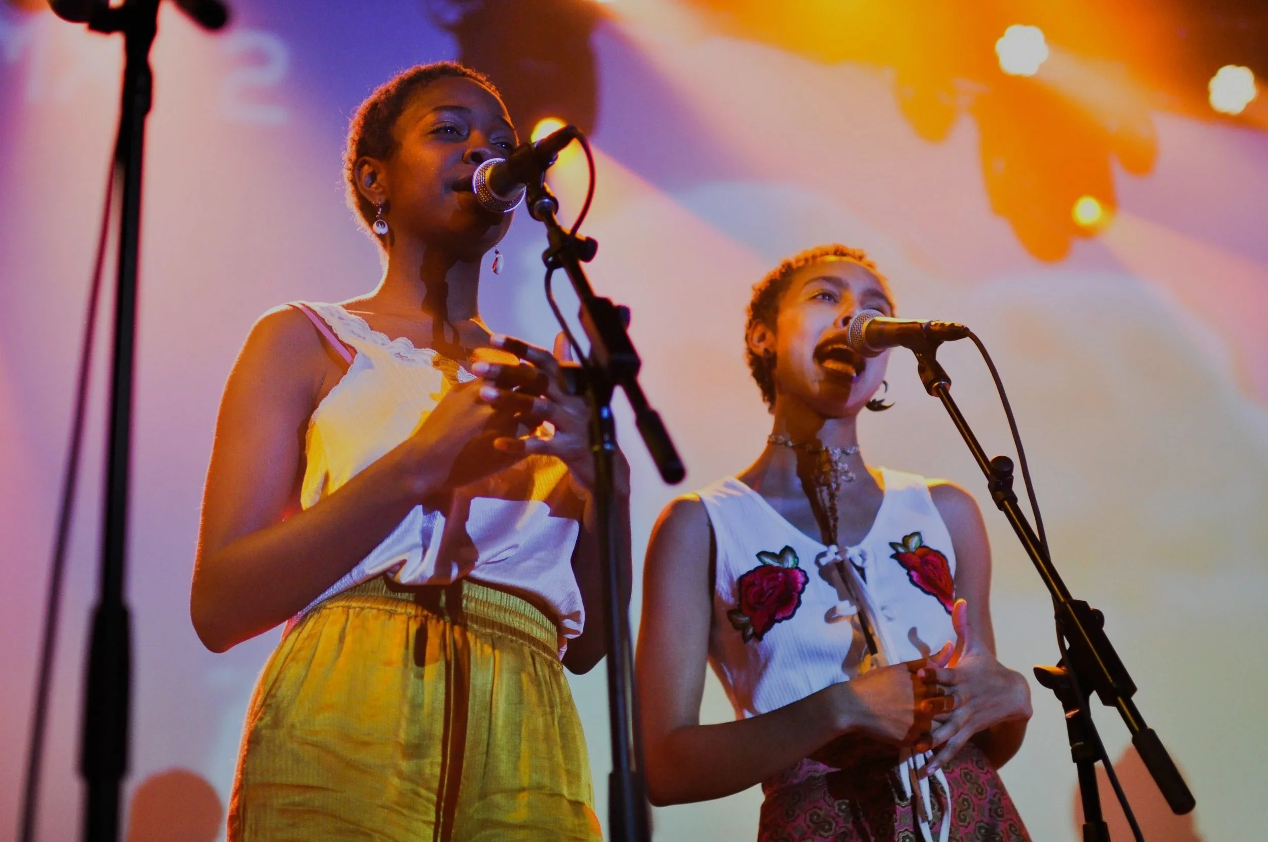 Backup vocalists performing with Tasha, a musician from Chicago