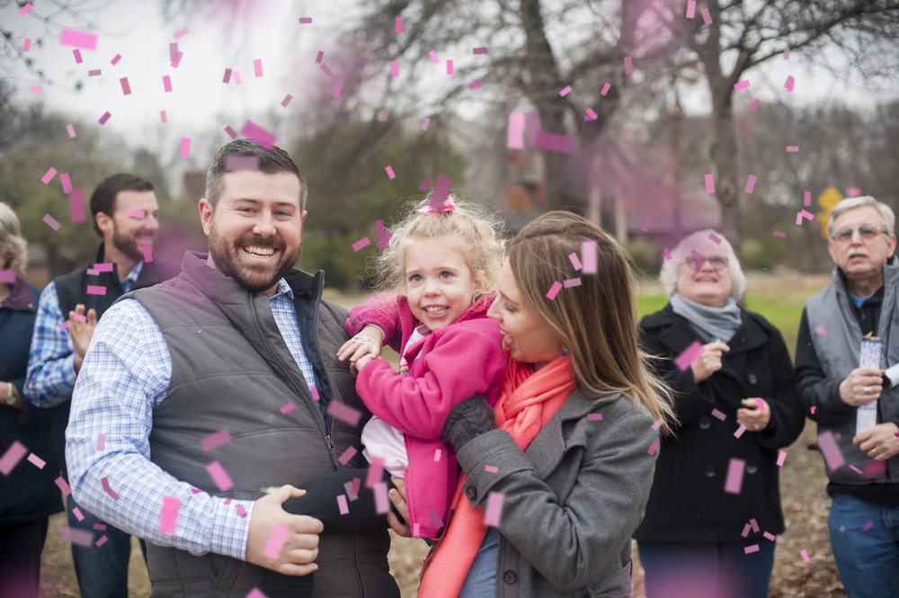 Confetti cannon gender reveal with the entire family. It's a girl!