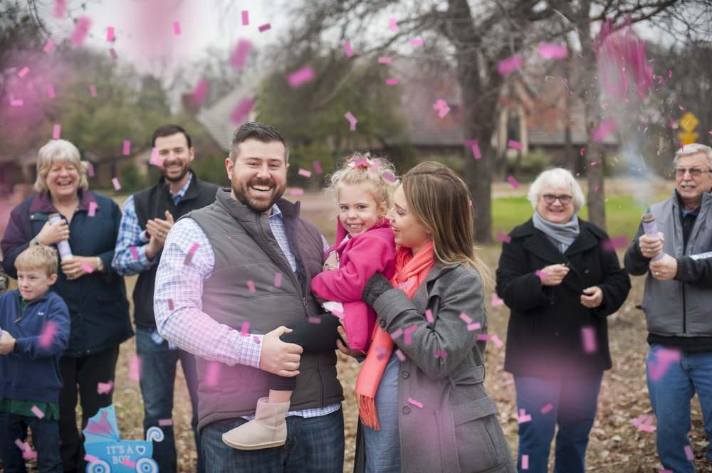 Confetti cannon gender reveal with the entire family. It's a girl!